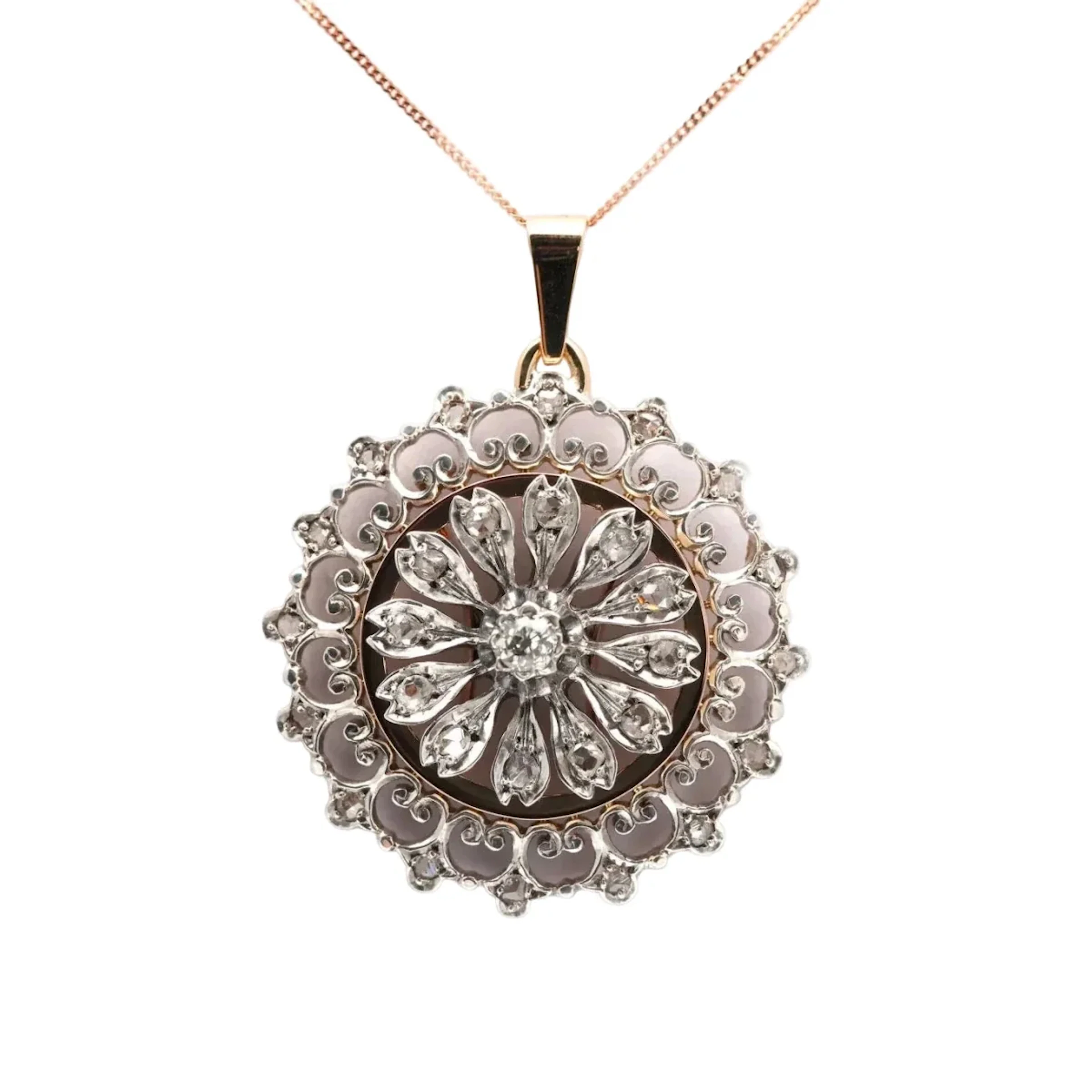 Yellow gold, silver, and diamond pendant