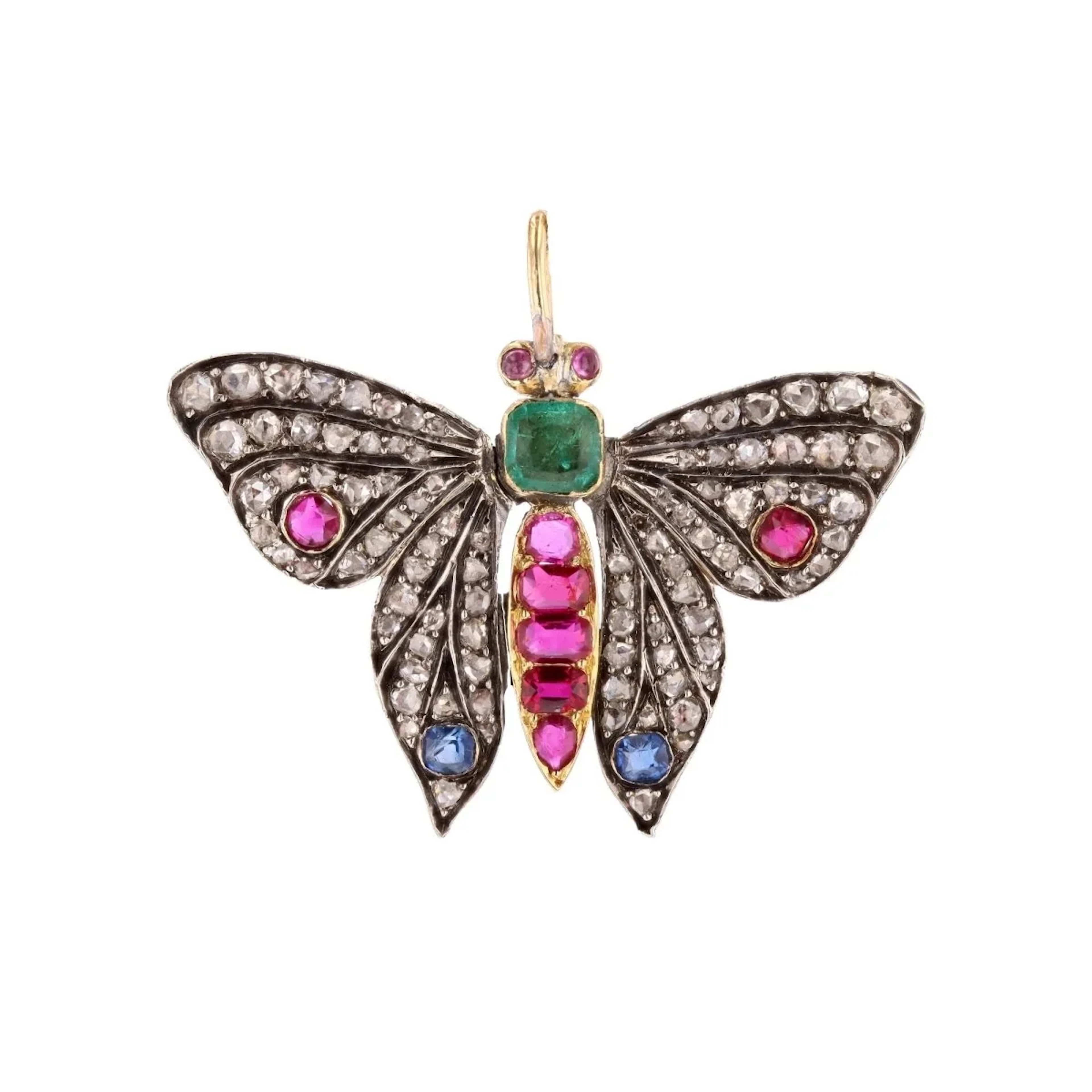 Pendentif en or jaune, argent, émeraude, rubis, saphirs et diamants