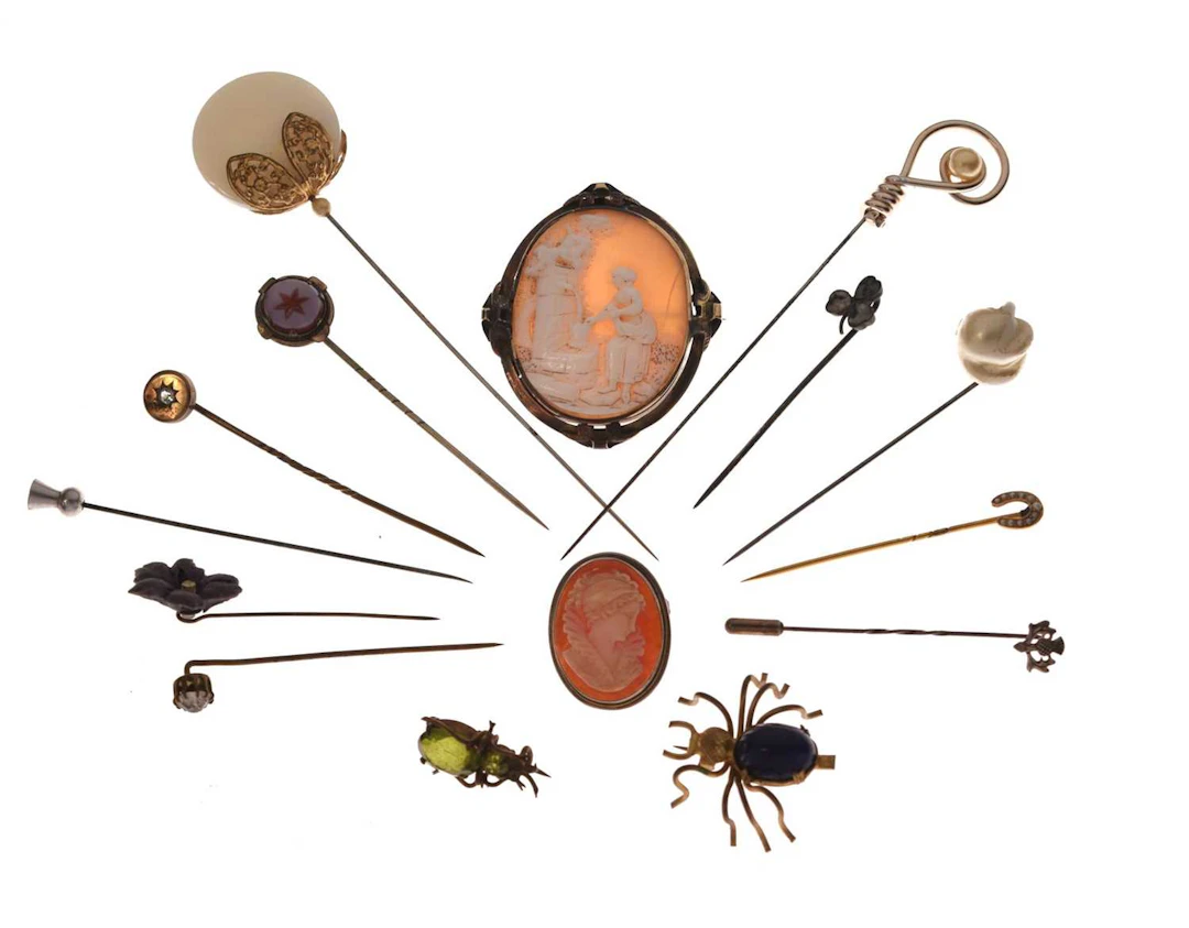 Group of hat pins and brooches, etc