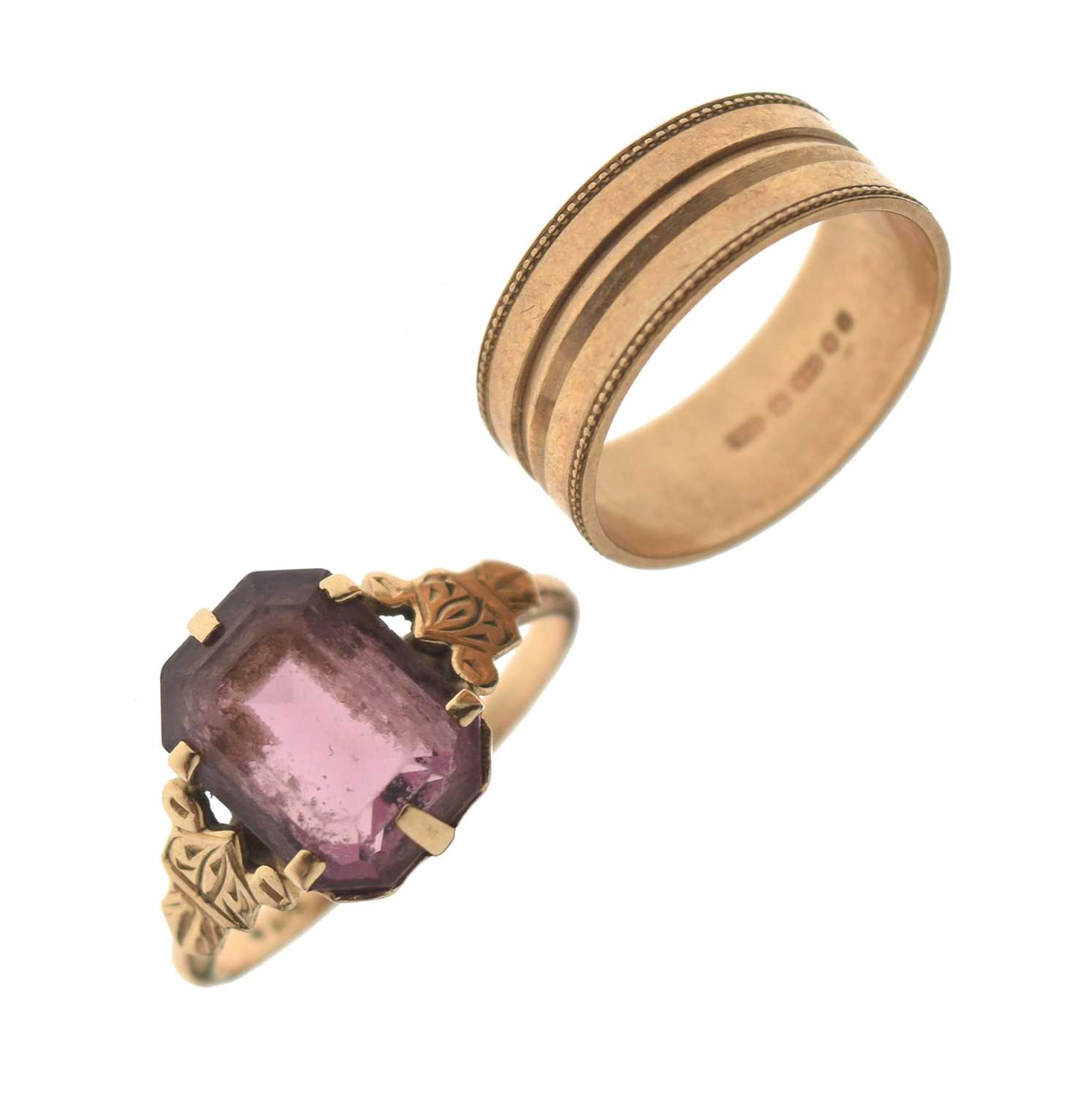 9ct gold patterned wedding band and a purple paste yellow metal dress ring (2)