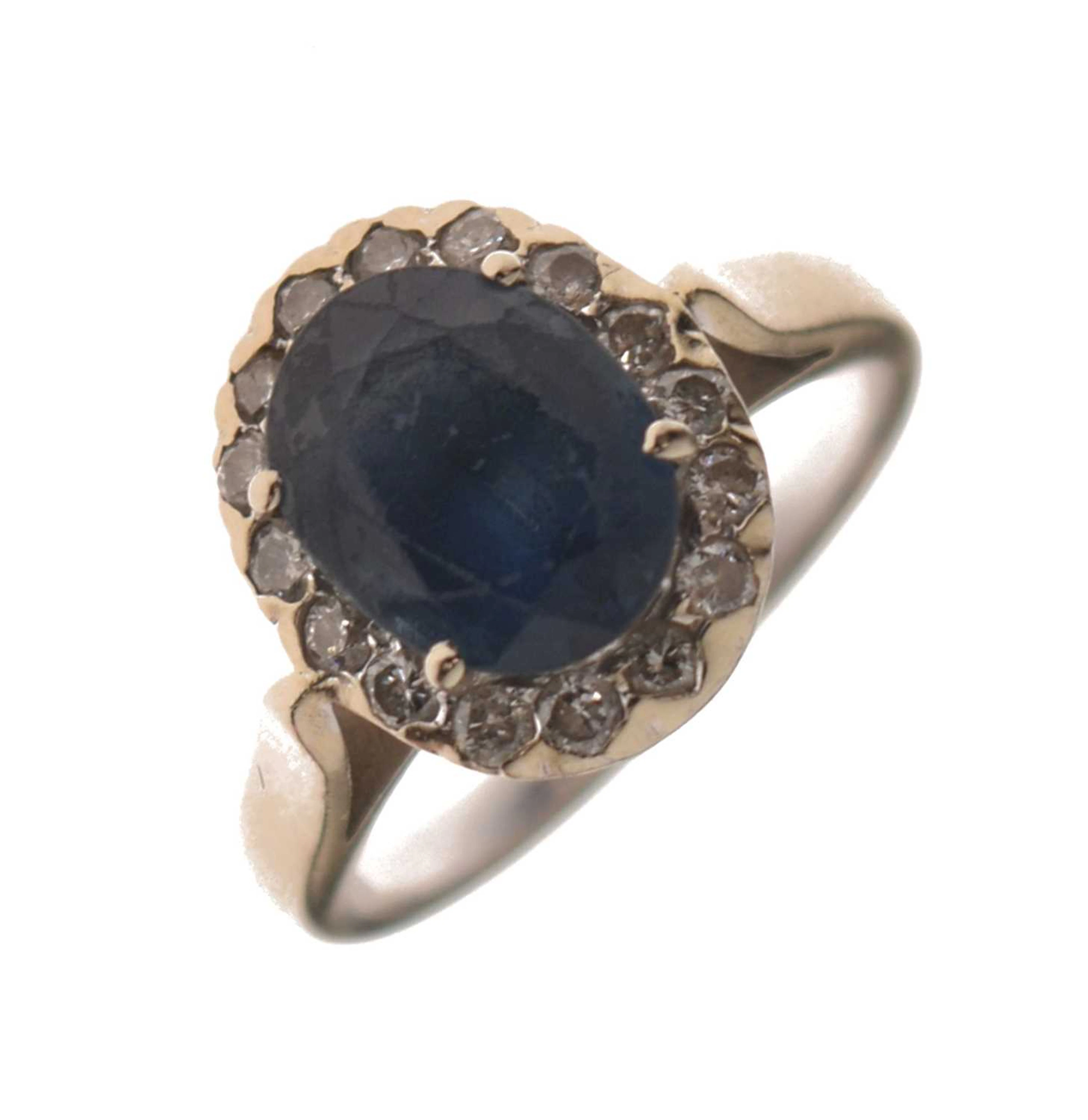 Sapphire and diamond white metal cluster ring, stamped '14K'
