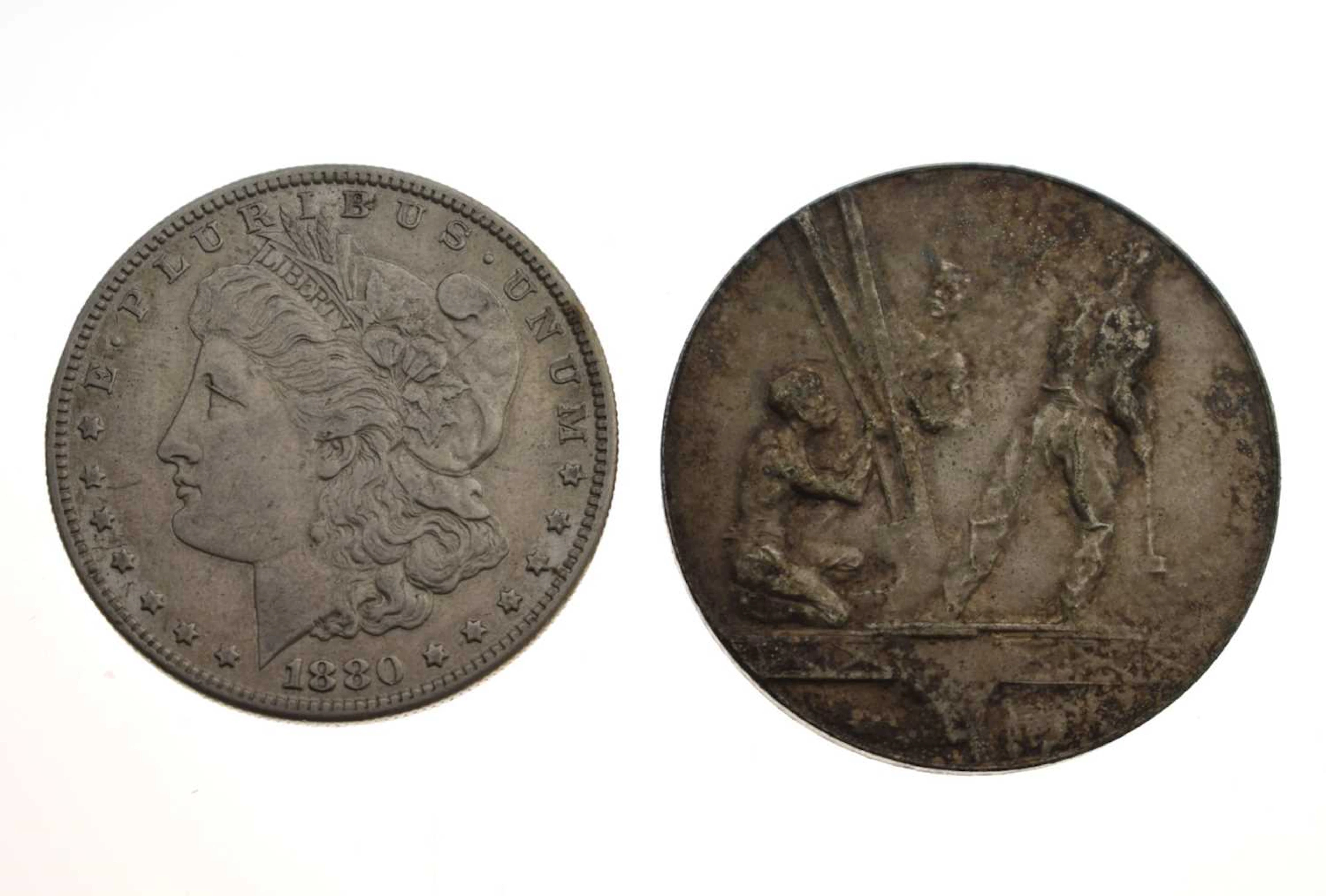1880 American silver one dollar, sealed in card mount, plus Eiffel