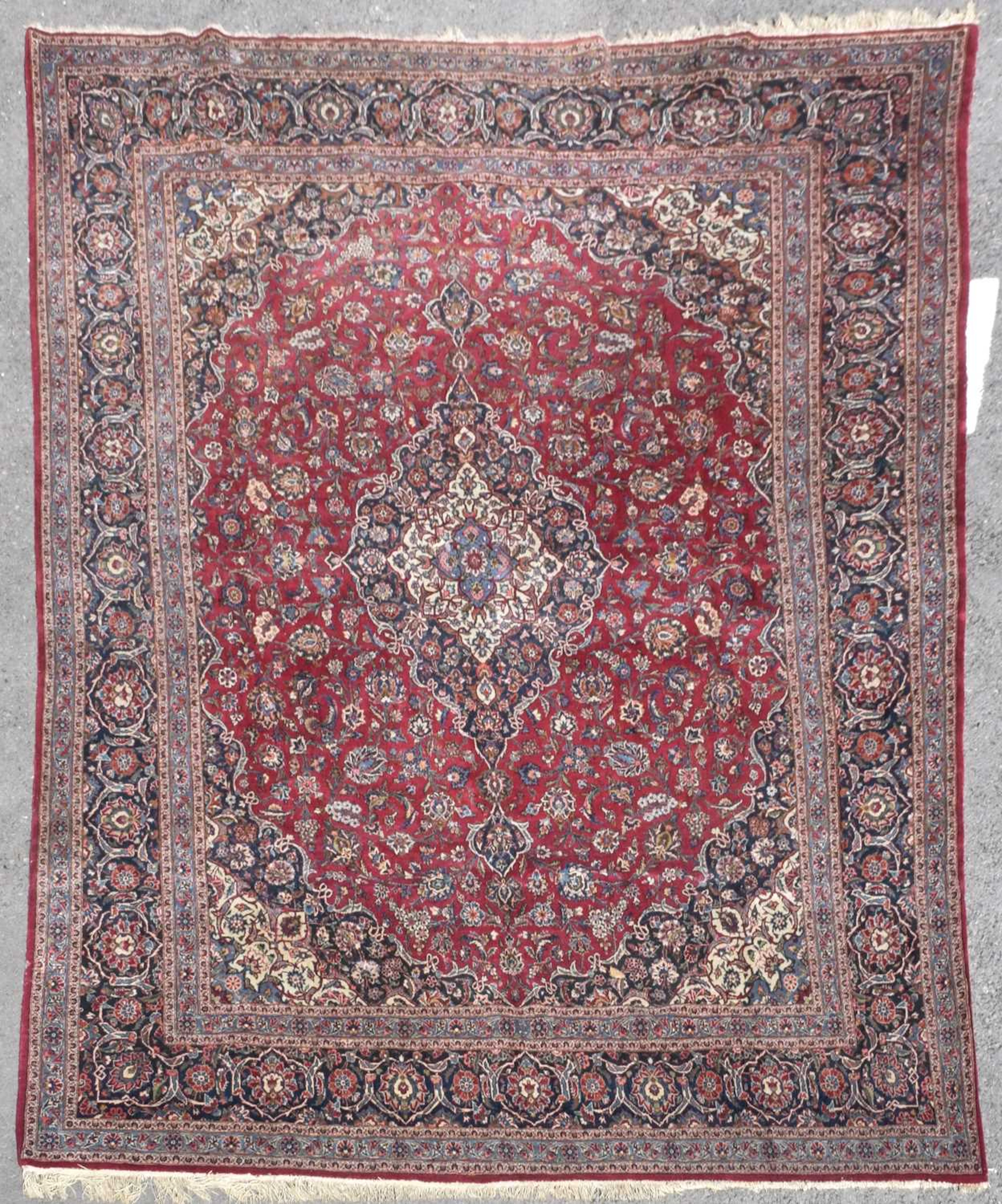 Large Middle Eastern red ground wool rug