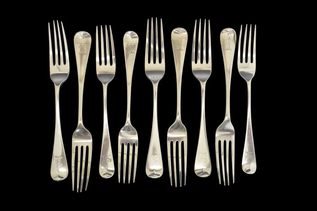 Matched set of nine silver Old English pattern dessert or side forks