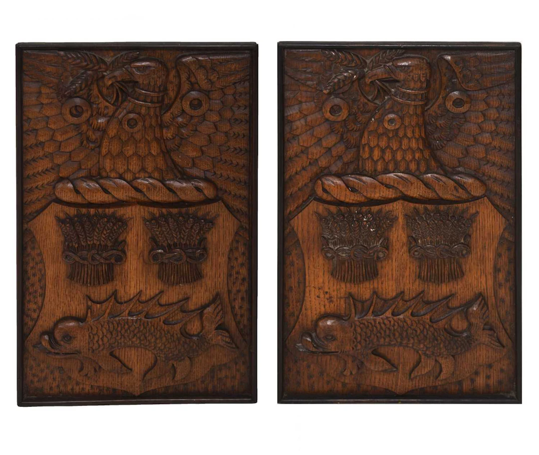 Pair of early 20th century carved oak armorial panels