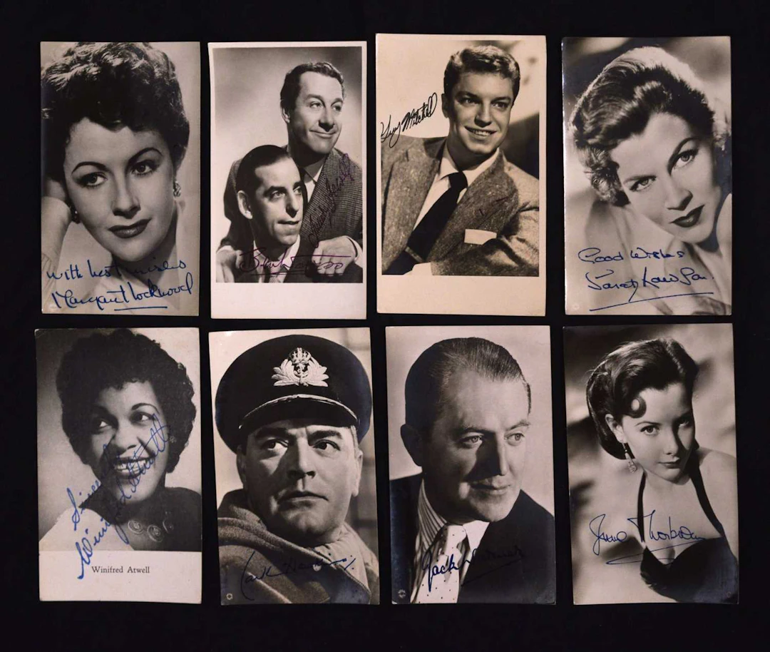 Collection of autographs and portrait photographs featuring entertainers