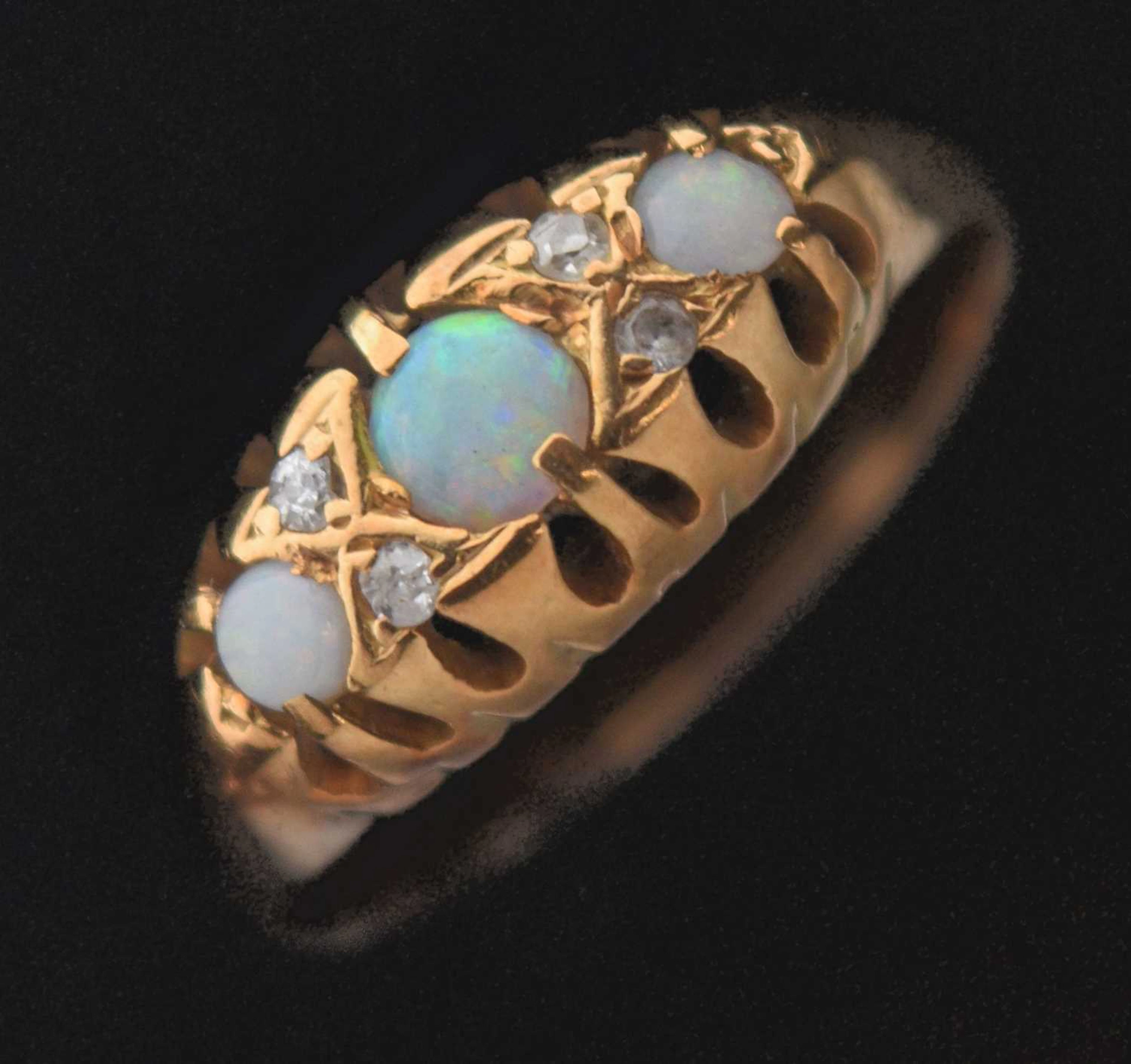 Opal and diamond 18ct gold ring