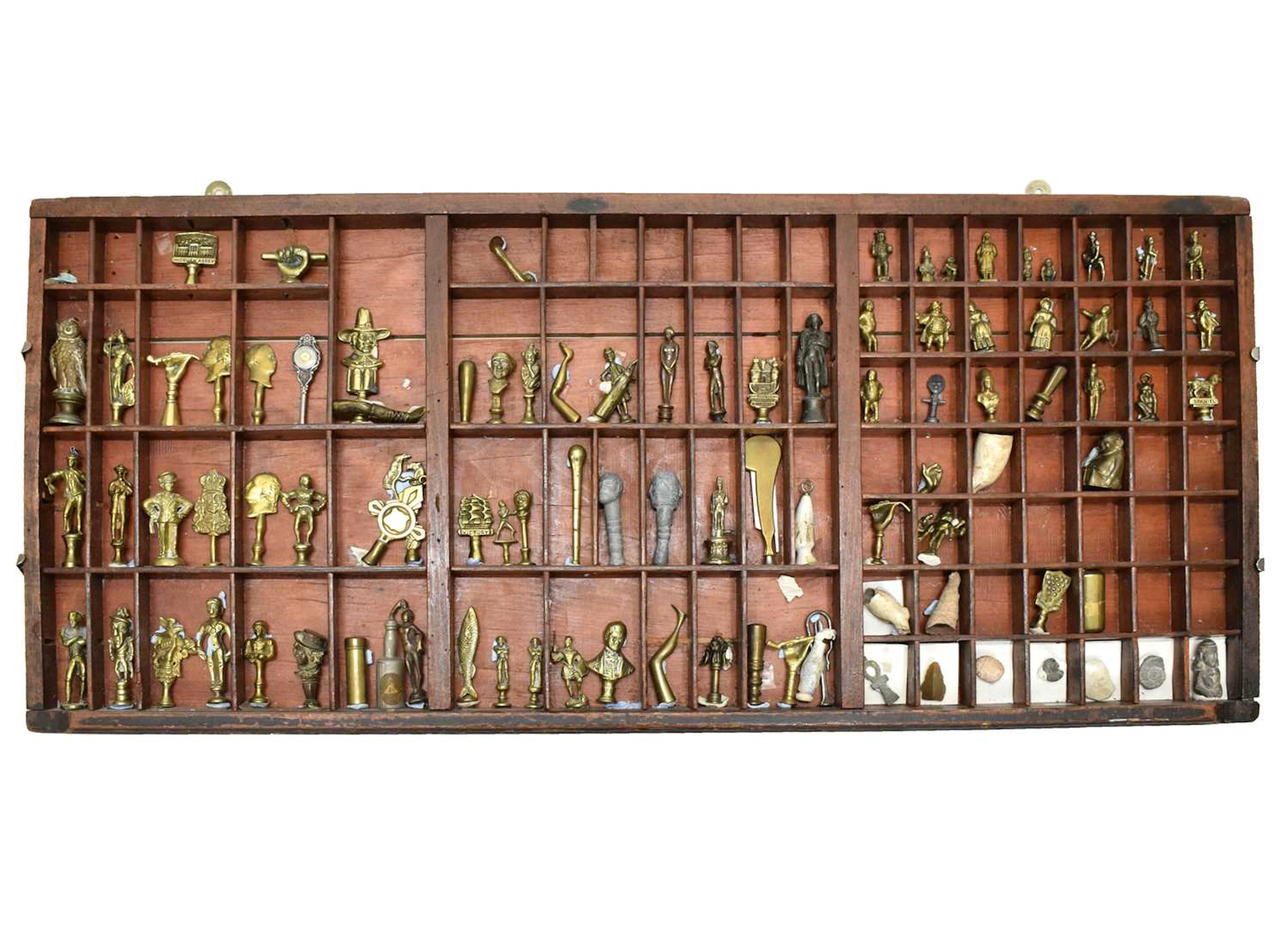 Large collection of antique and later pipe tampers and seals