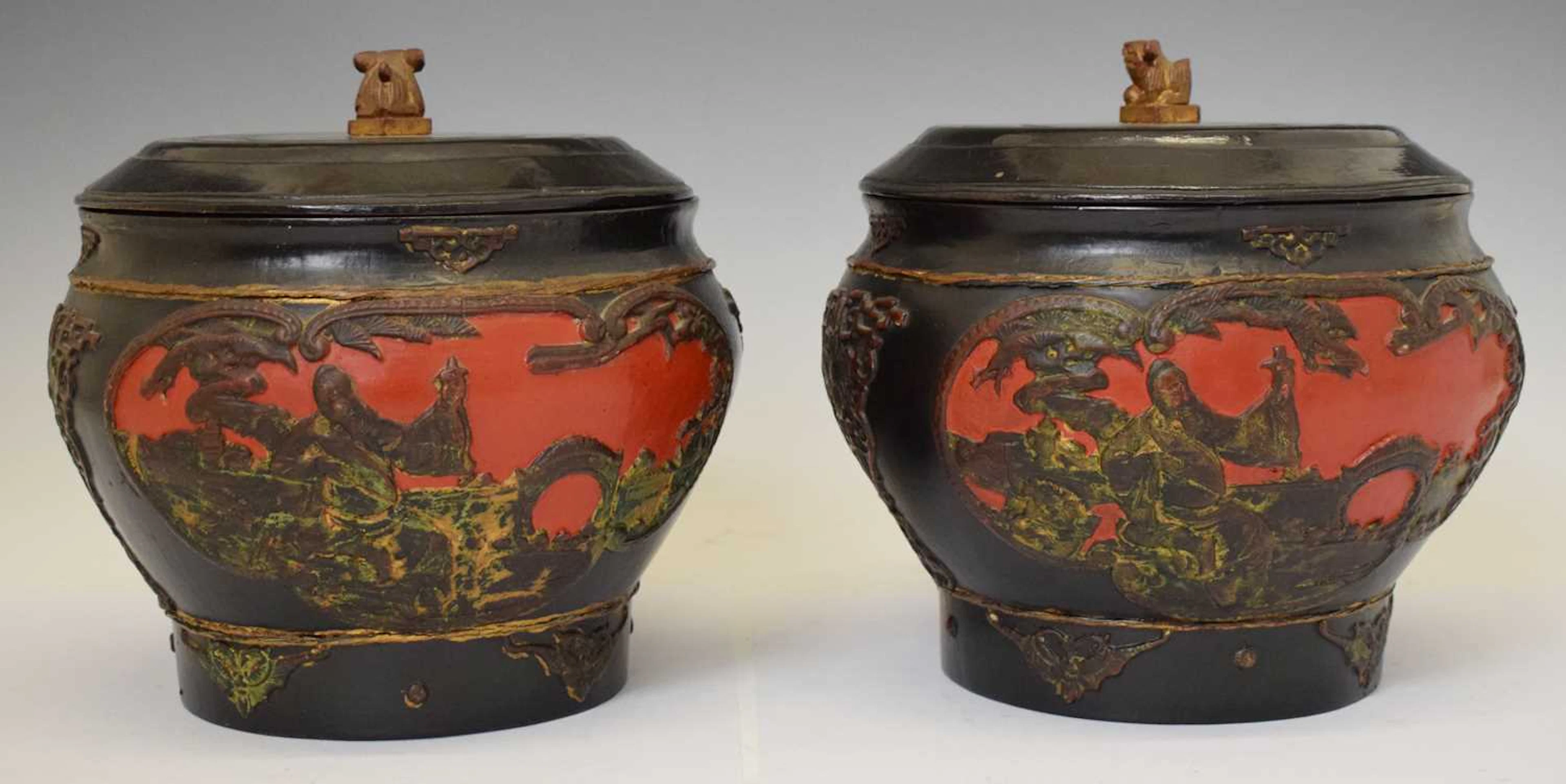 Pair of Chinese red and black lacquered wooden jars and covers