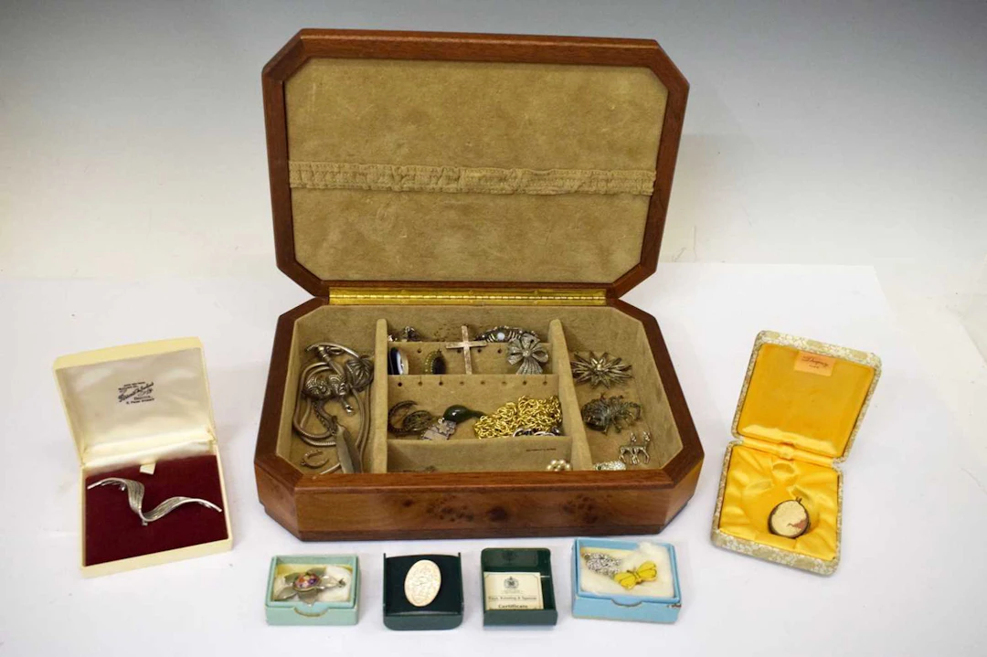 Wooden jewellery box with silver and white metal costume jewellery, etc