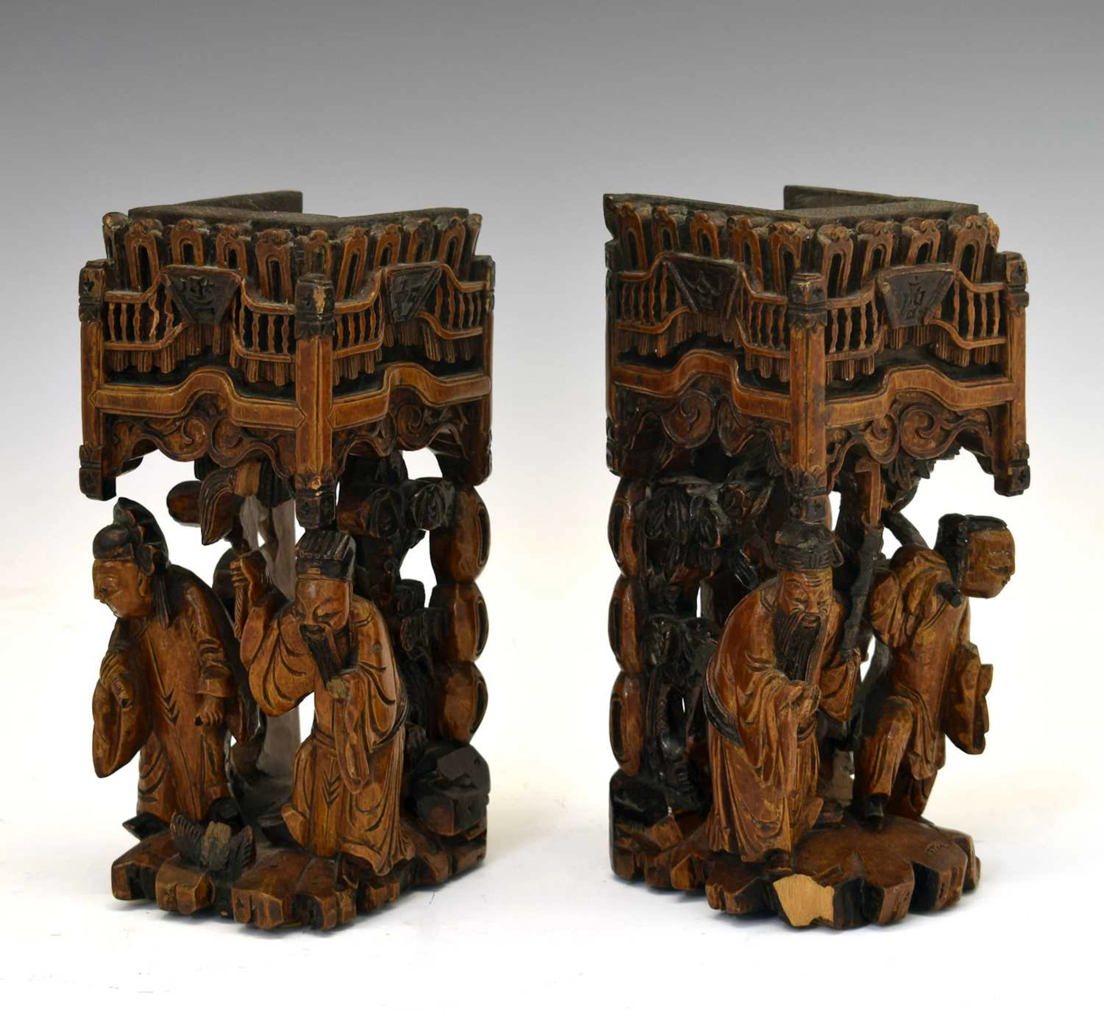 Pair of Chinese carved softwood figural furniture stands
