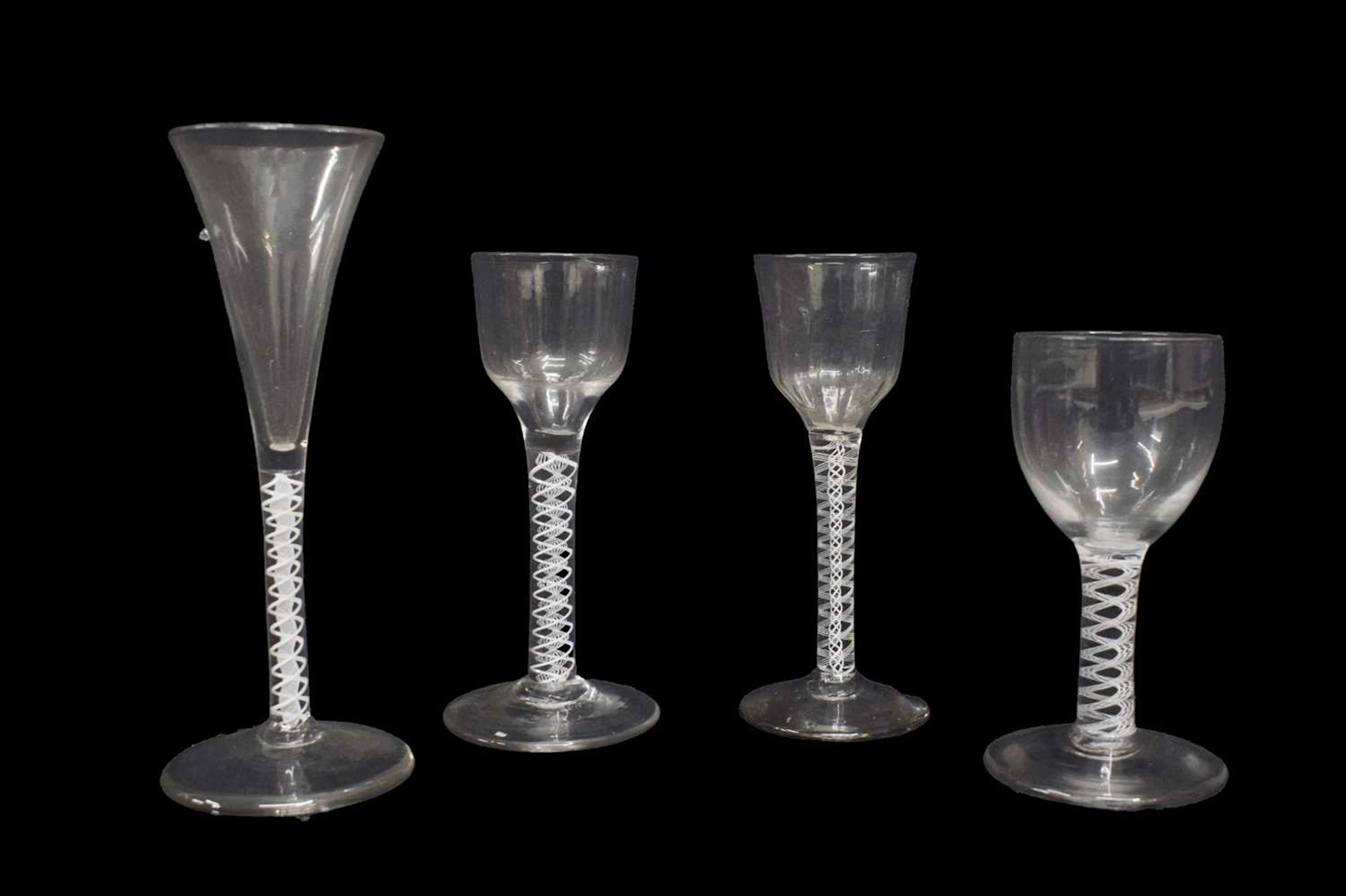 Group of four opaque twist stem glasses