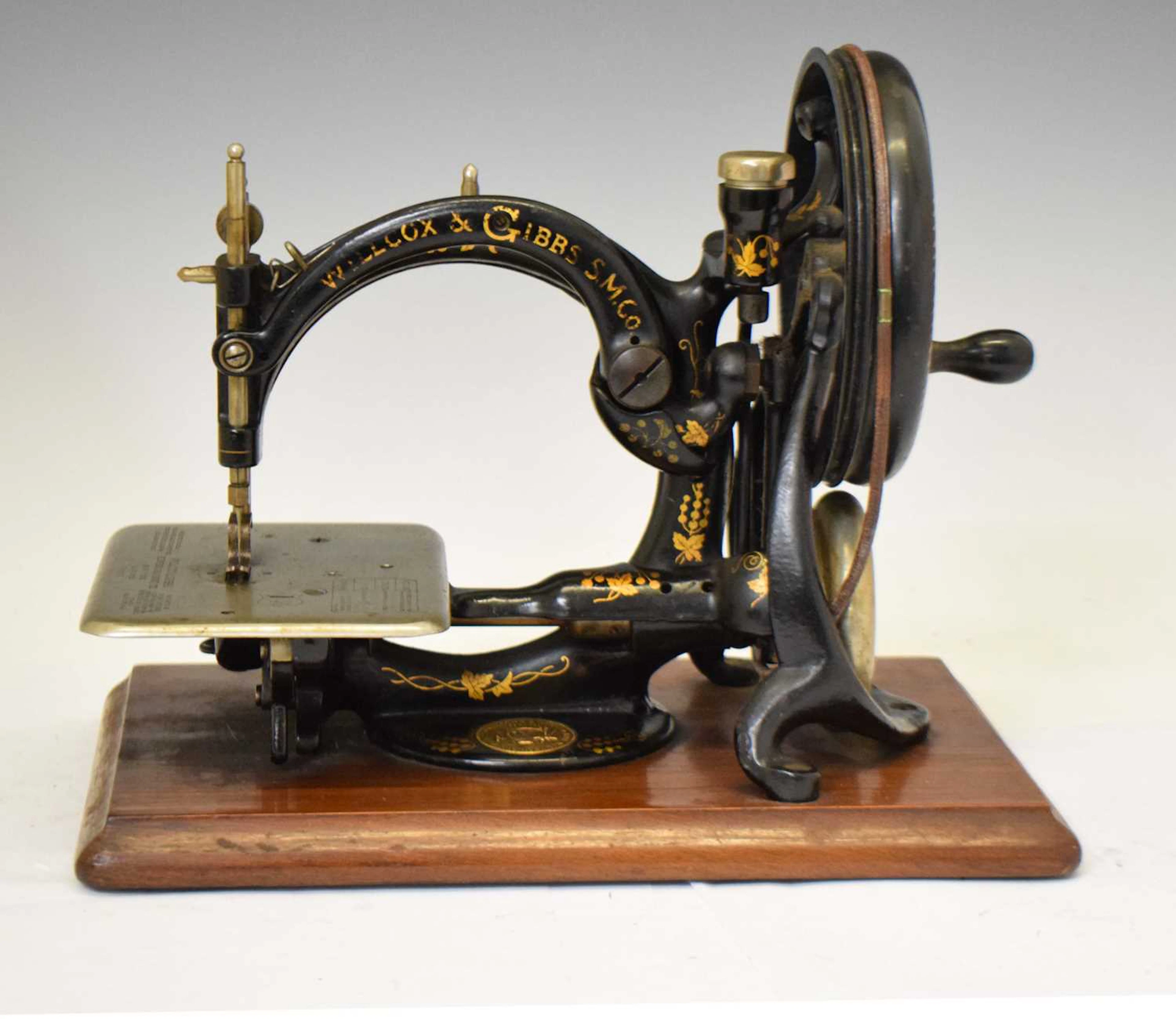 Late 19th century Willcox & Gibbs C-frame hand-cranked sewing machine