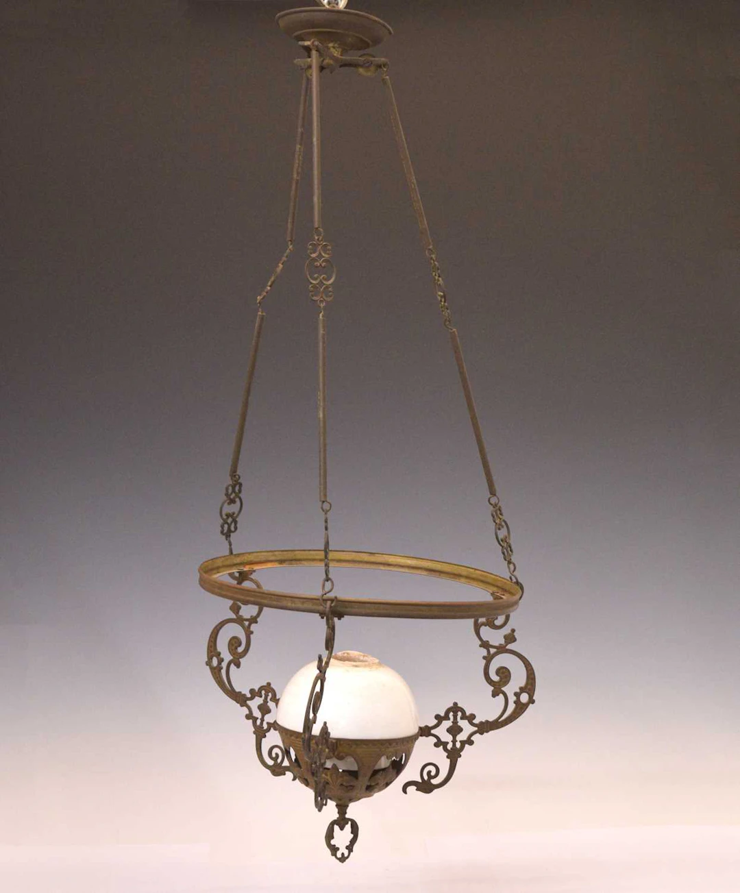 Early 20th century gilt metal and white glass 'stable' lamp
