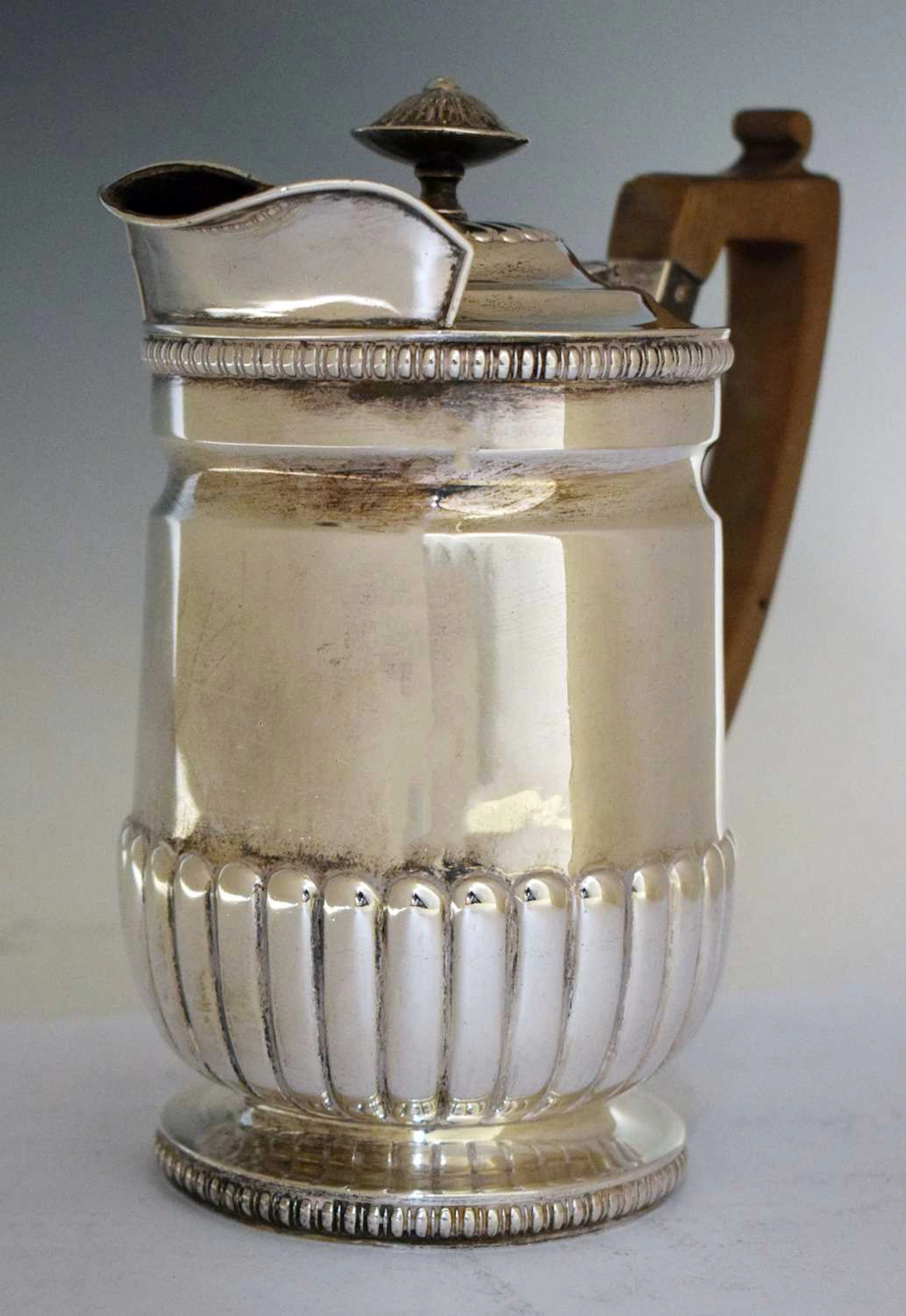 Victorian silver lidded jug with half gadroon decoration