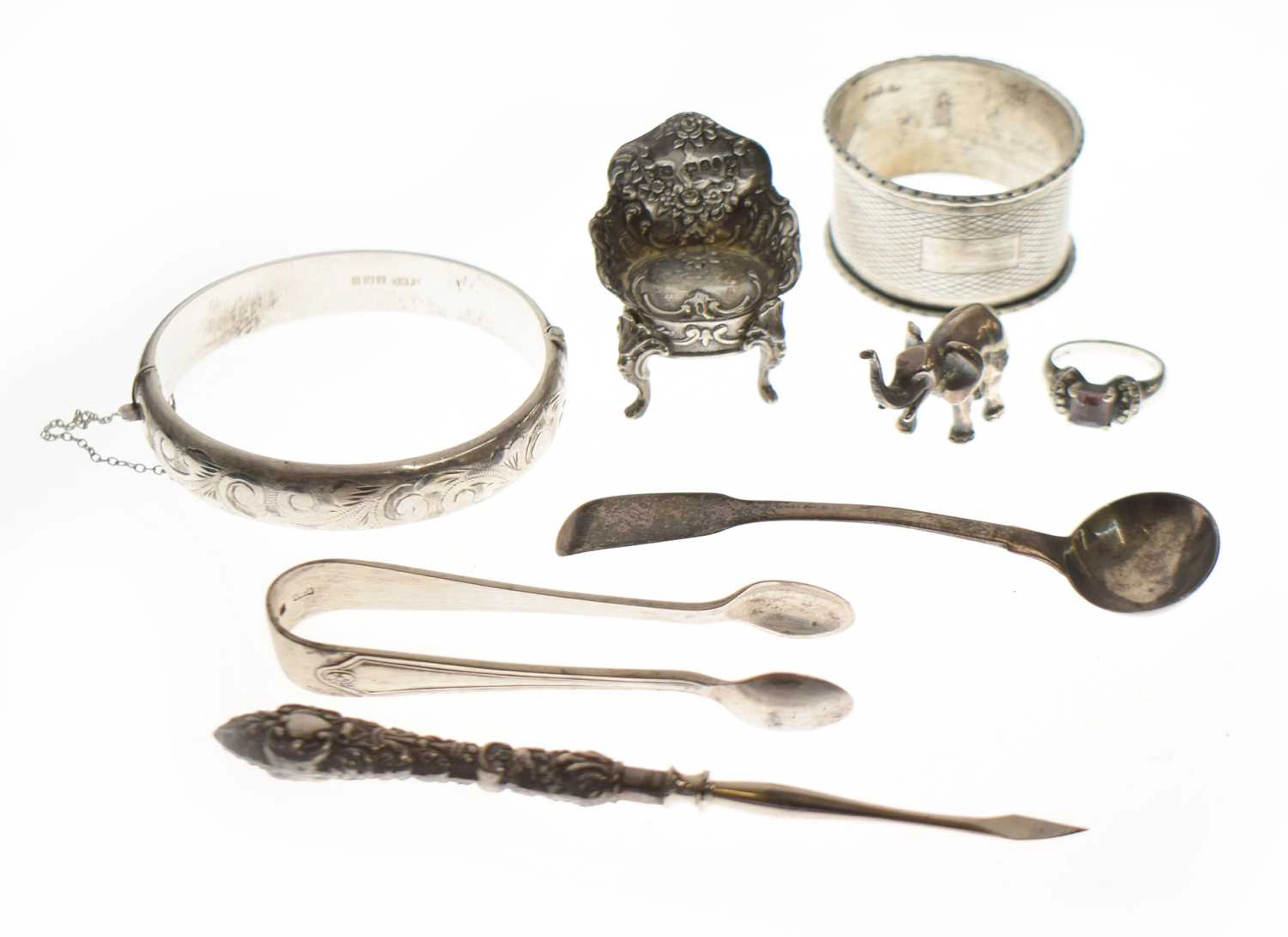 Collection of silver items to include a silver napkin ring, a miniature