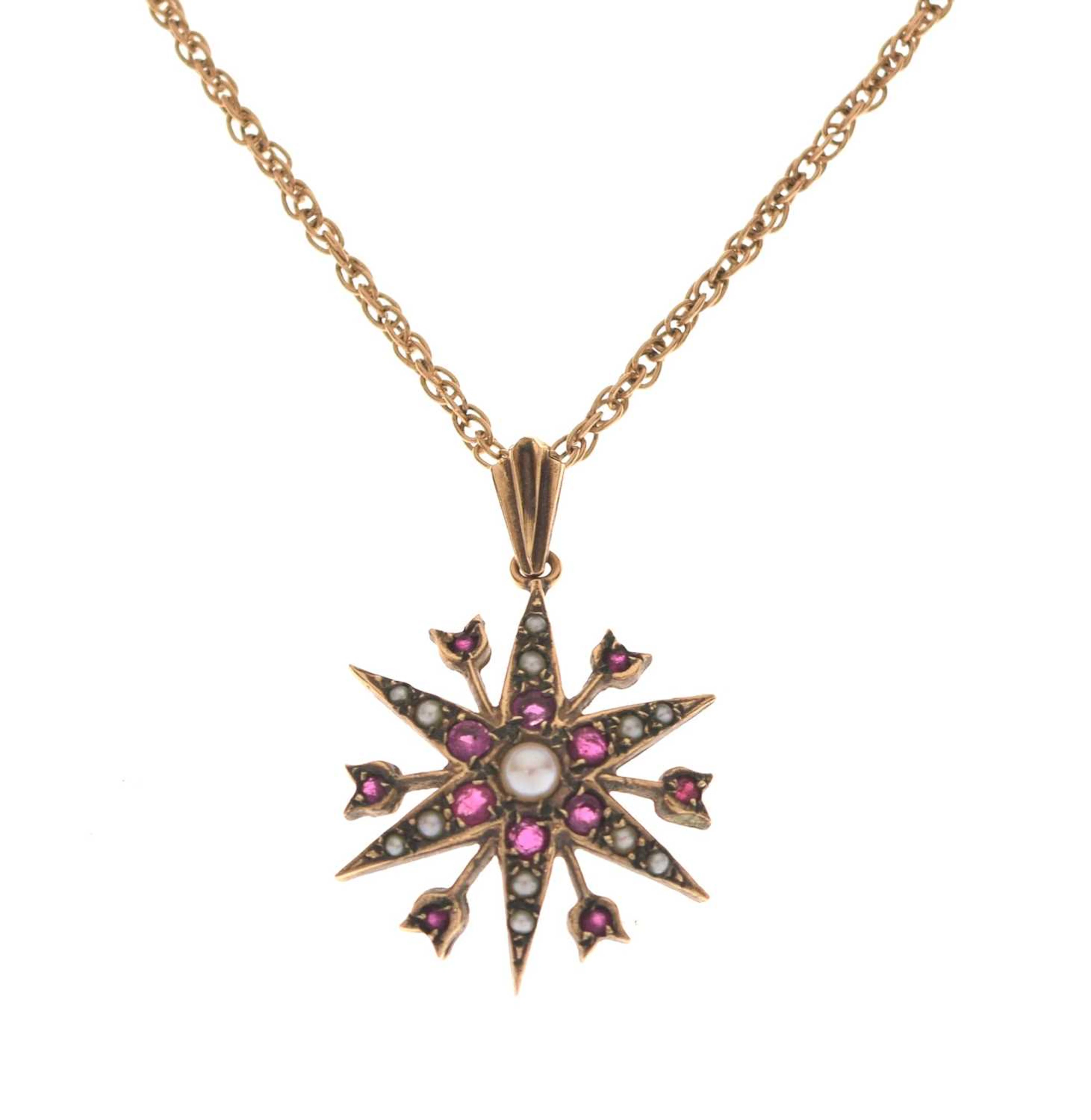 Ruby and seed pearl starburst 9ct gold pendant necklace