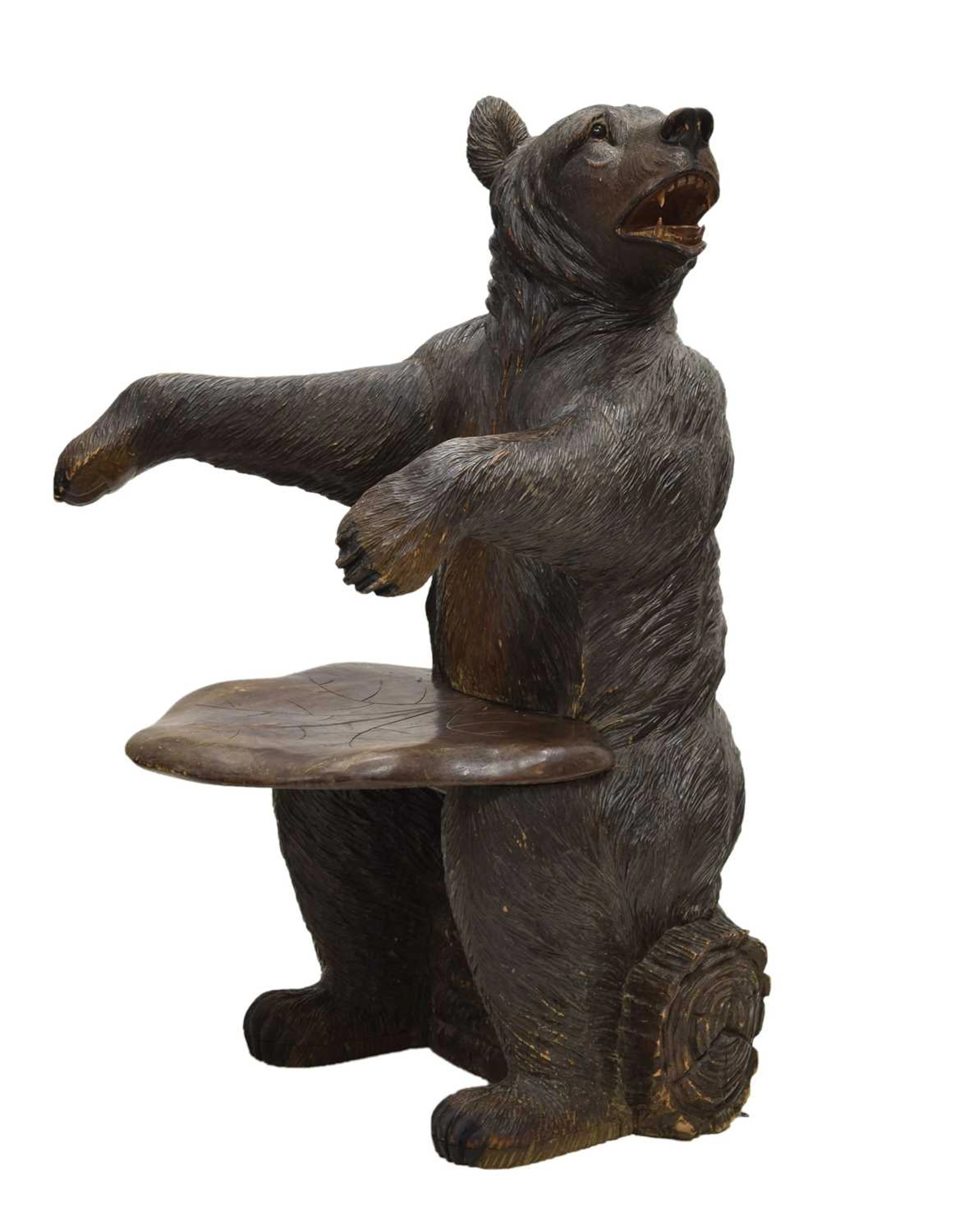 Rare 'Black Forest' carved and stained wood hall chair in the form