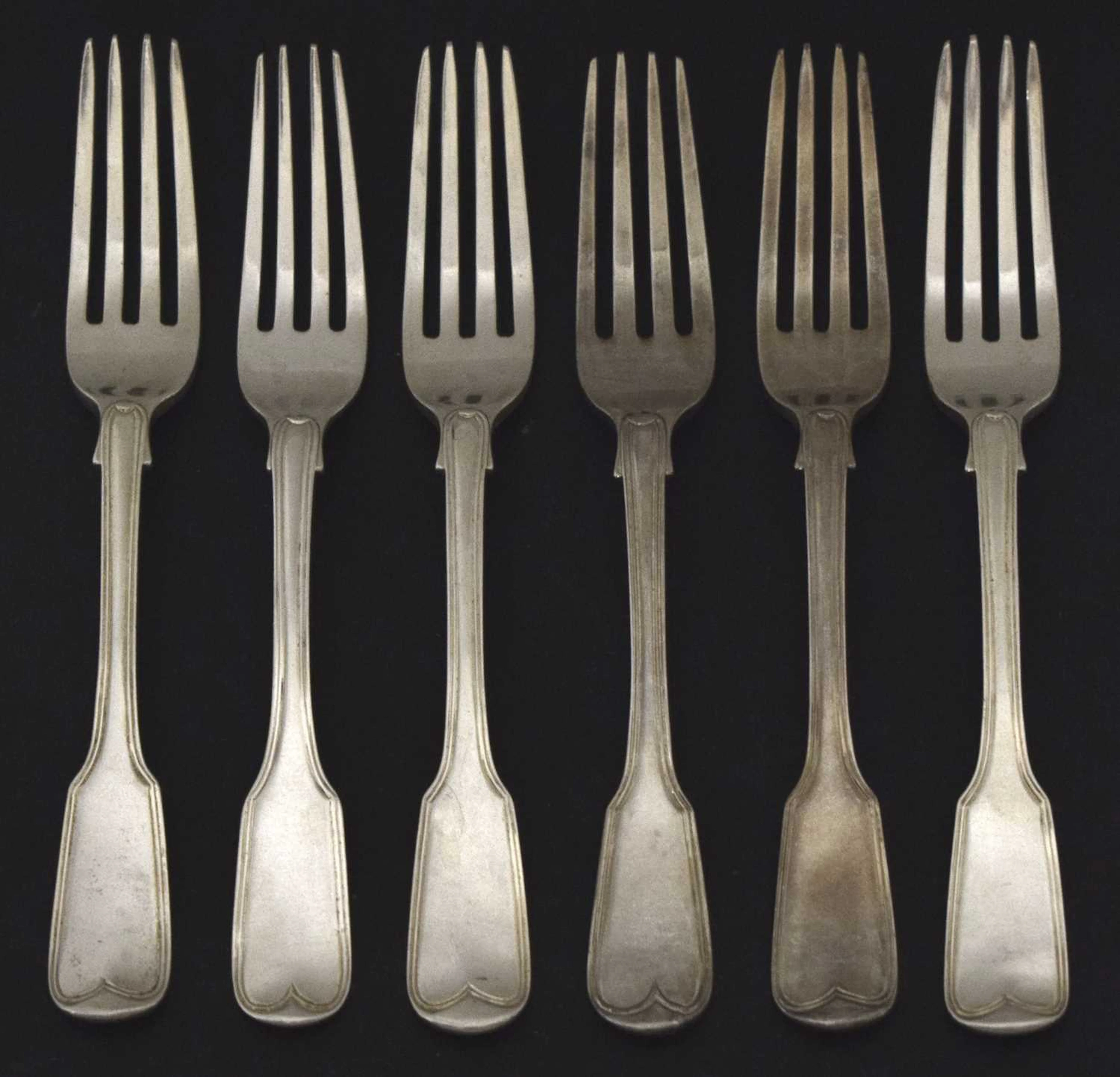 Matched set of six silver fiddle and thread pattern dessert forks