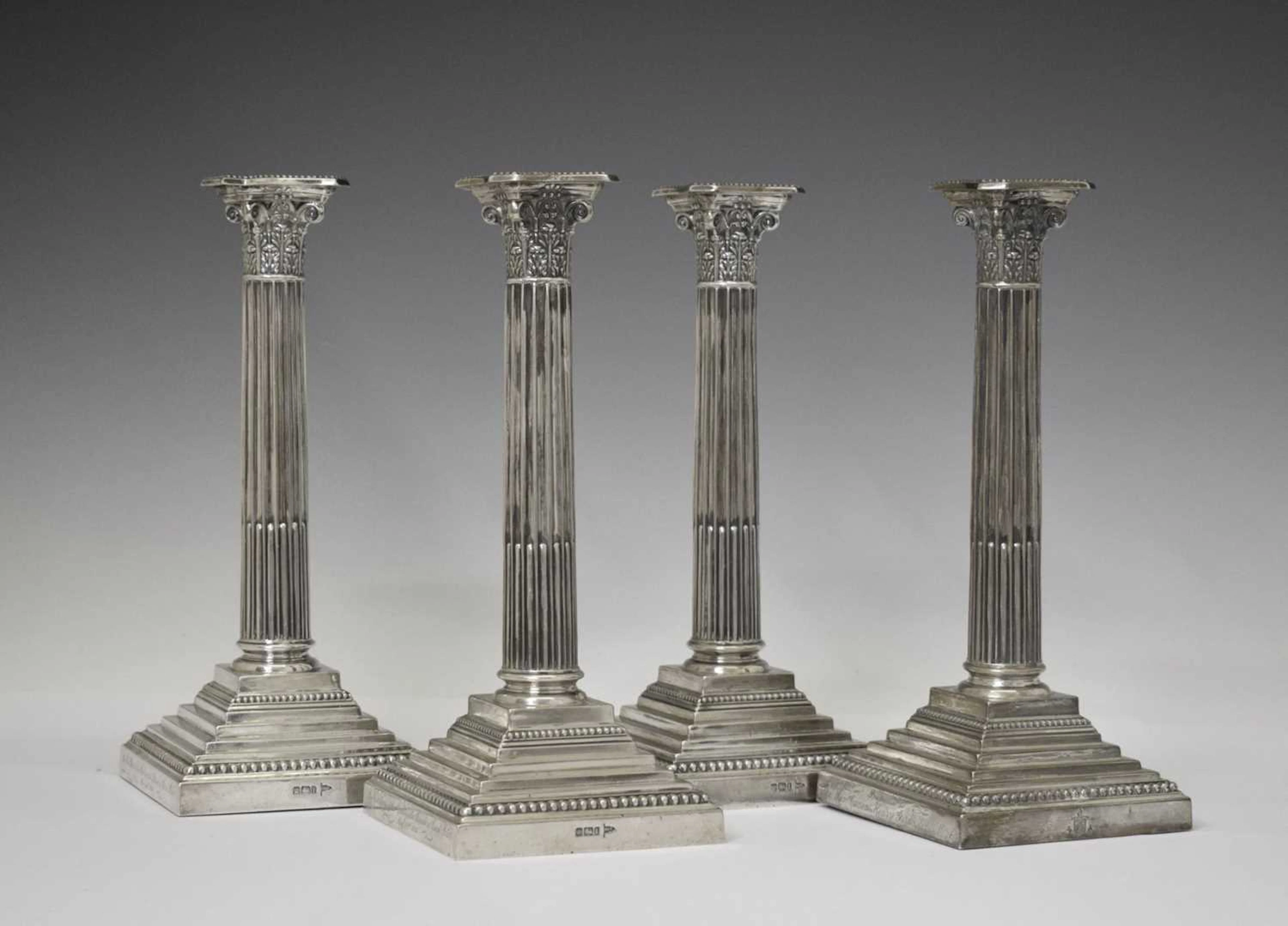Set of four Edwardian candlesticks, of Corinthian column form