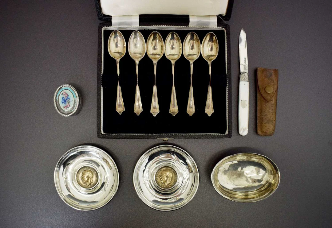 Collection of silver items, coffee spoons, pin dishes, etc
