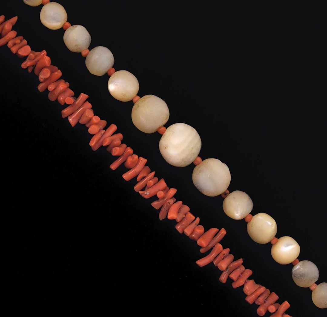 Mother-of-pearl and coral bead necklace, and a fringed coral necklace (a/f) (2)