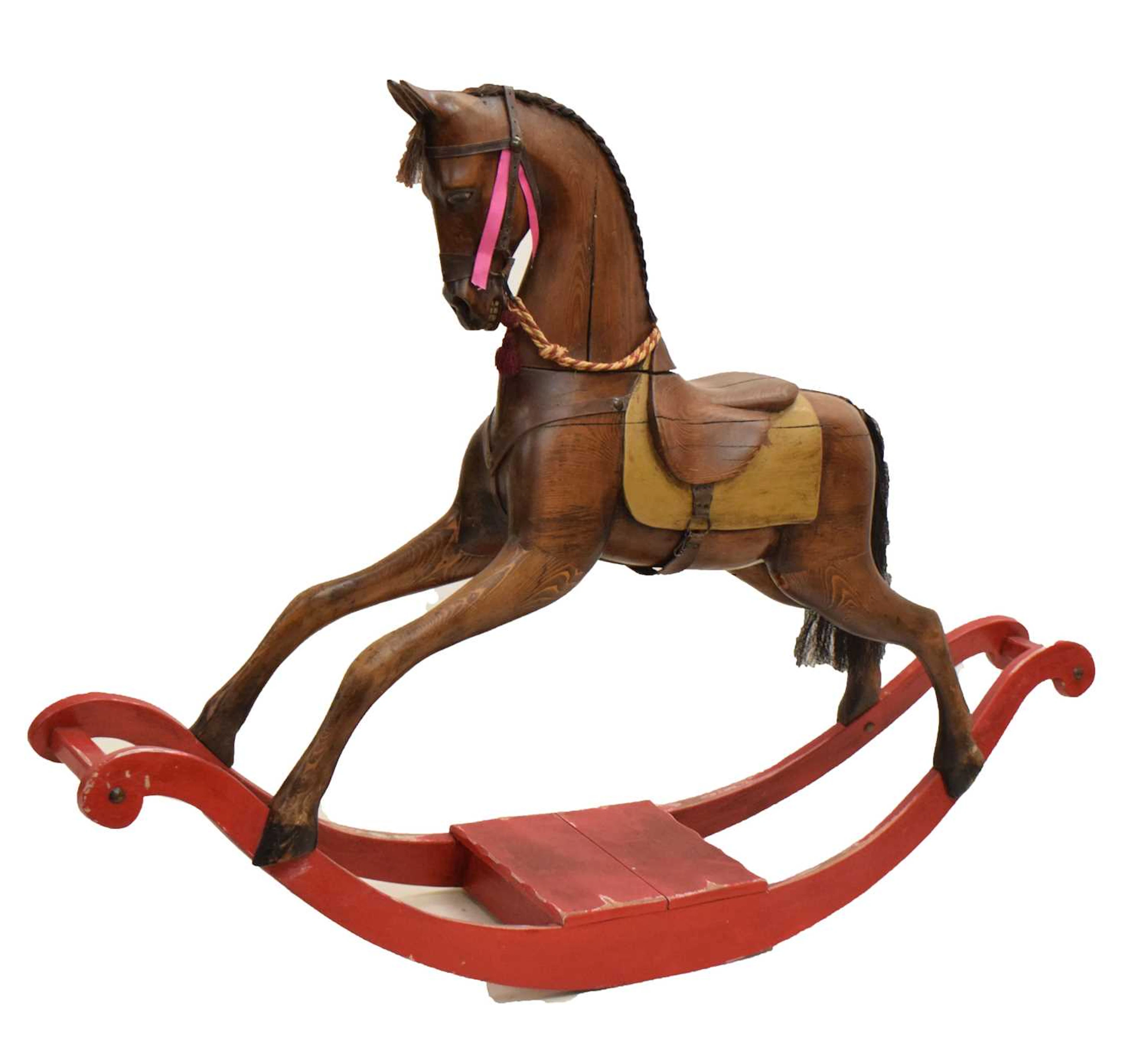 20th century carved wooden rocking horse raised on red stained rocker