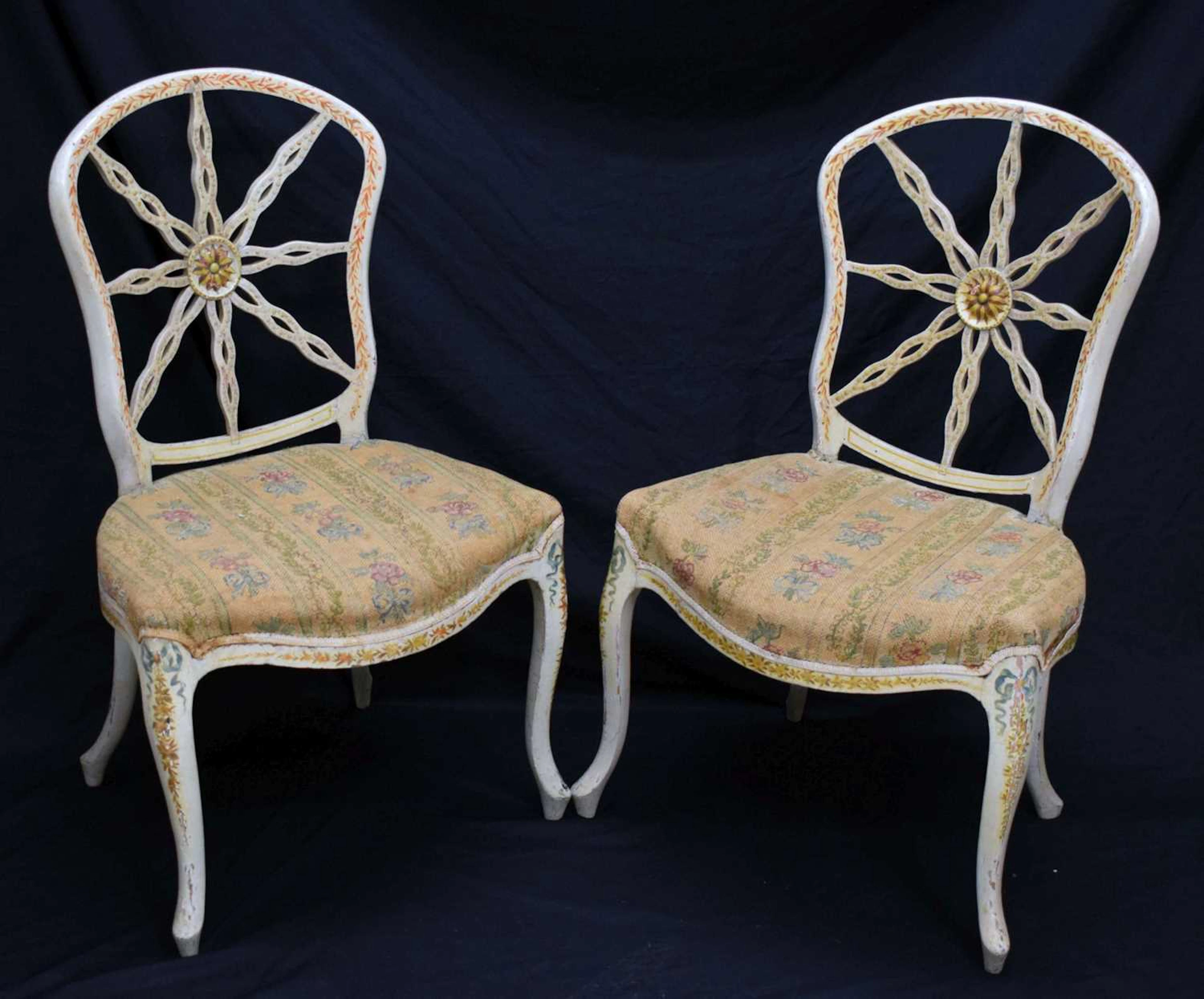 Pair of George III star back dining chairs in the manner of Thomas Chippendale