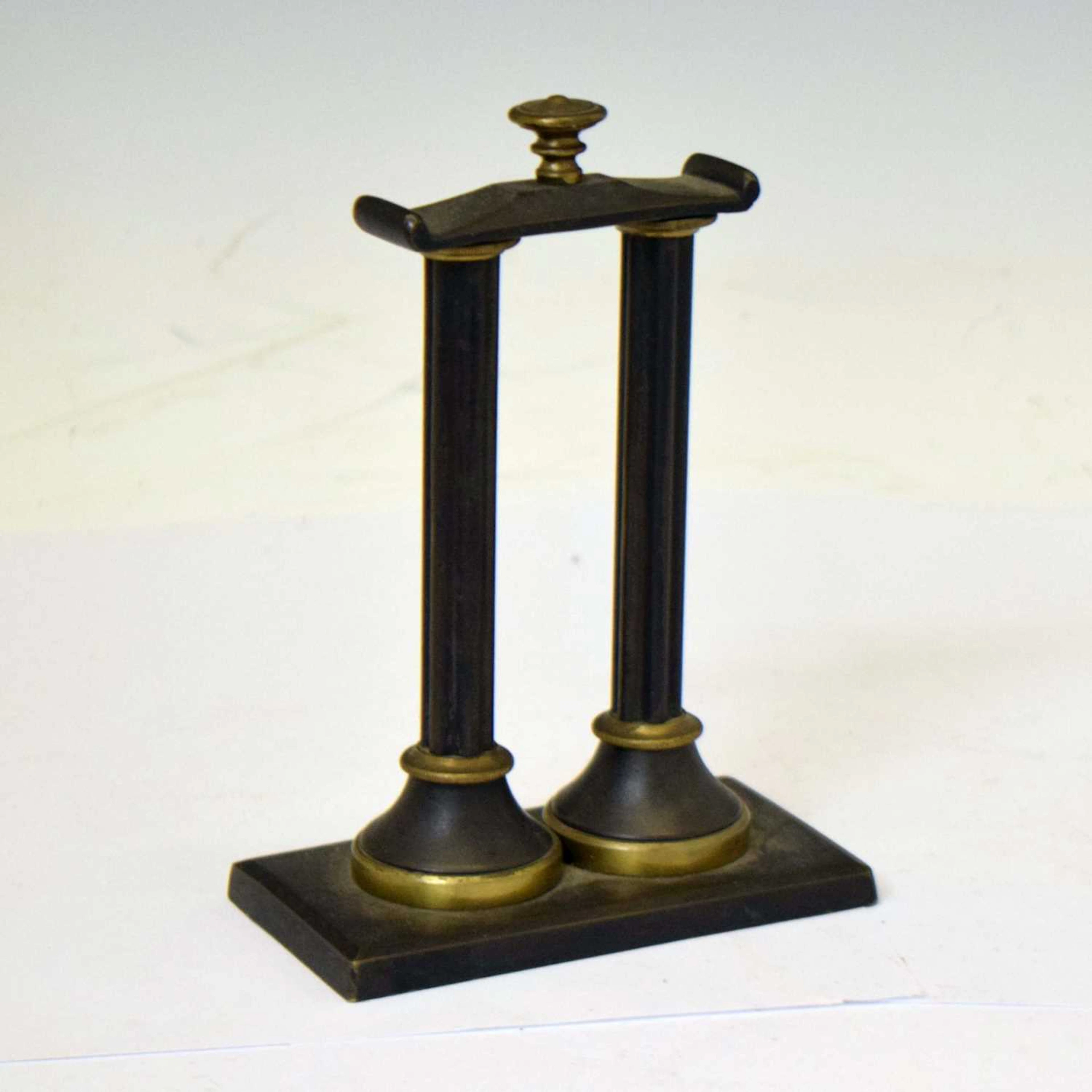 Early 20th century bronze watch stand in the form of two classical pillars
