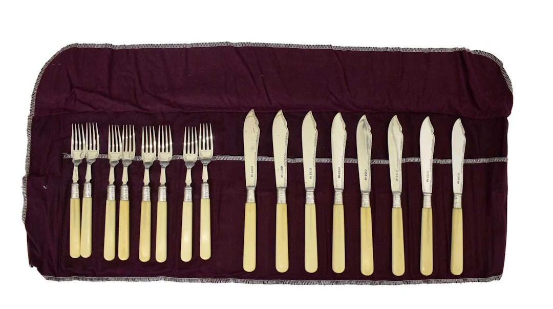 Set of eight George V silver-bladed fish knives and forks