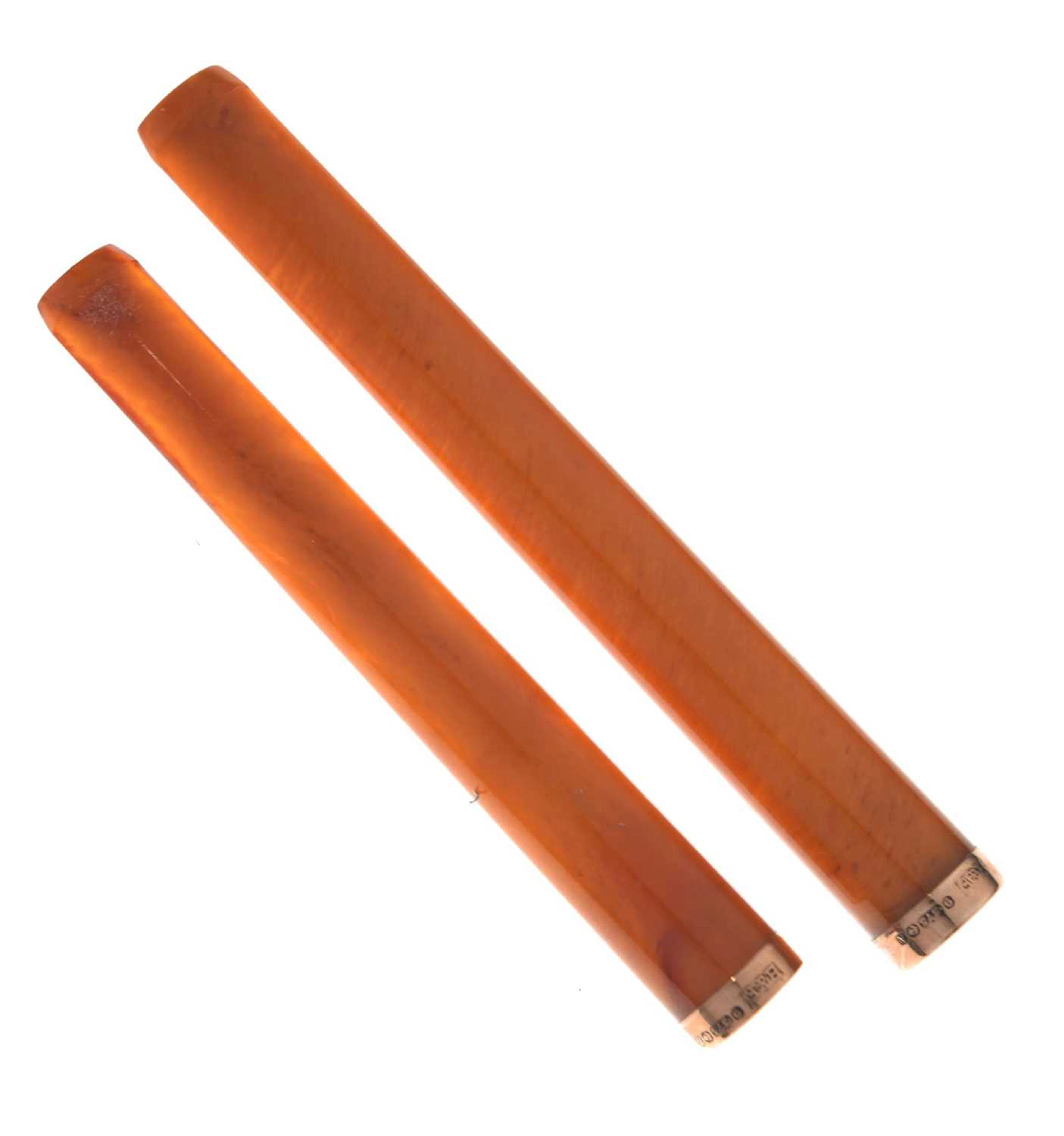 Two 1920s 'Amber' 9ct gold mounted cheroot holders