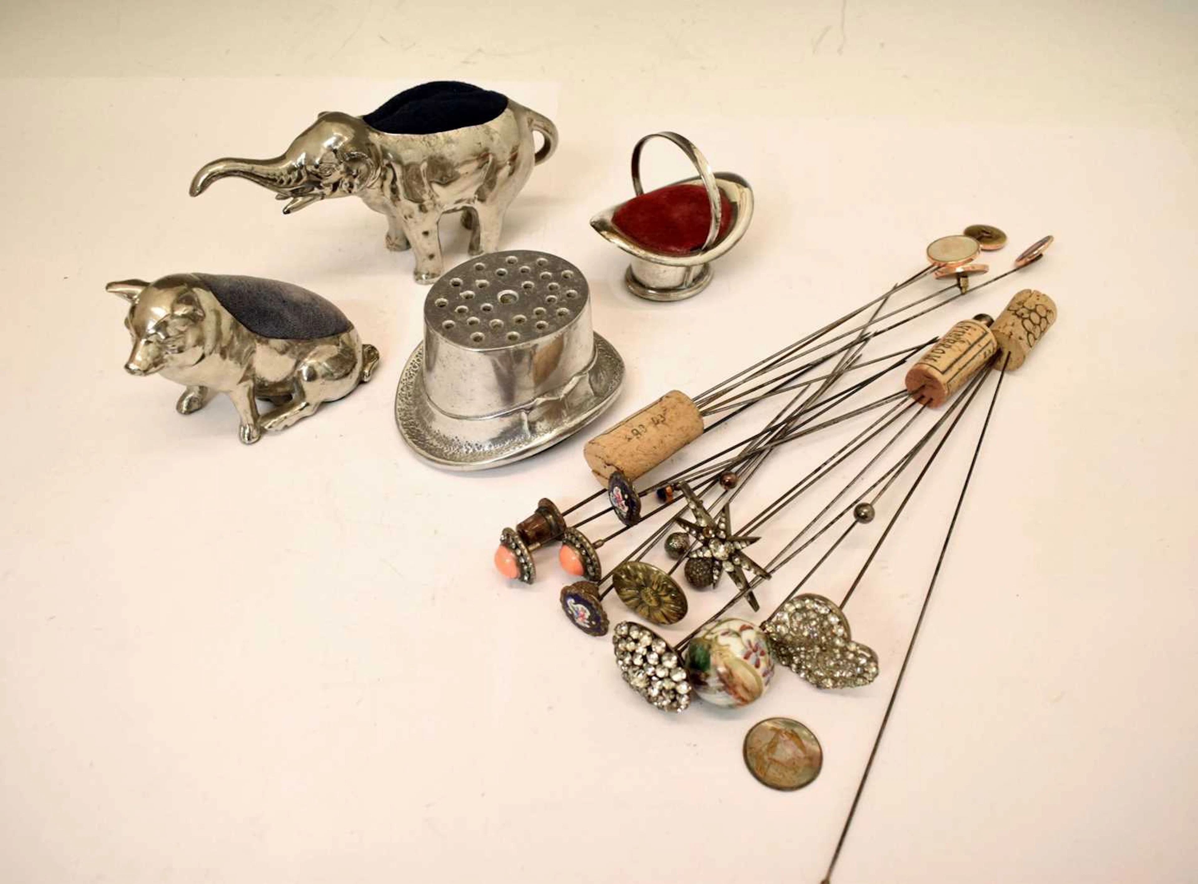 Four novelty hat pin holders, together with a collection of early