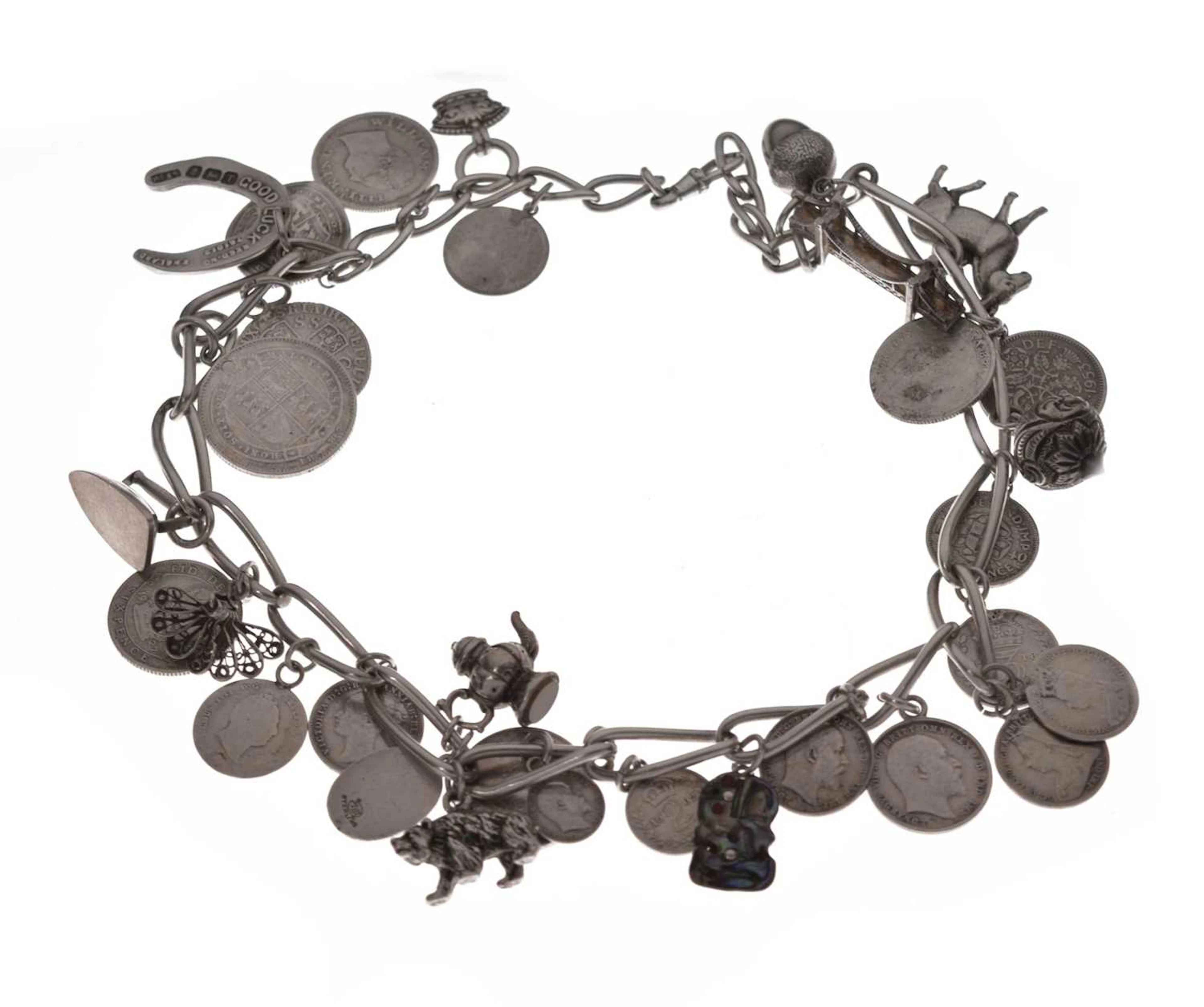 Sterling silver necklace attached a quantity of coins and charms, etc