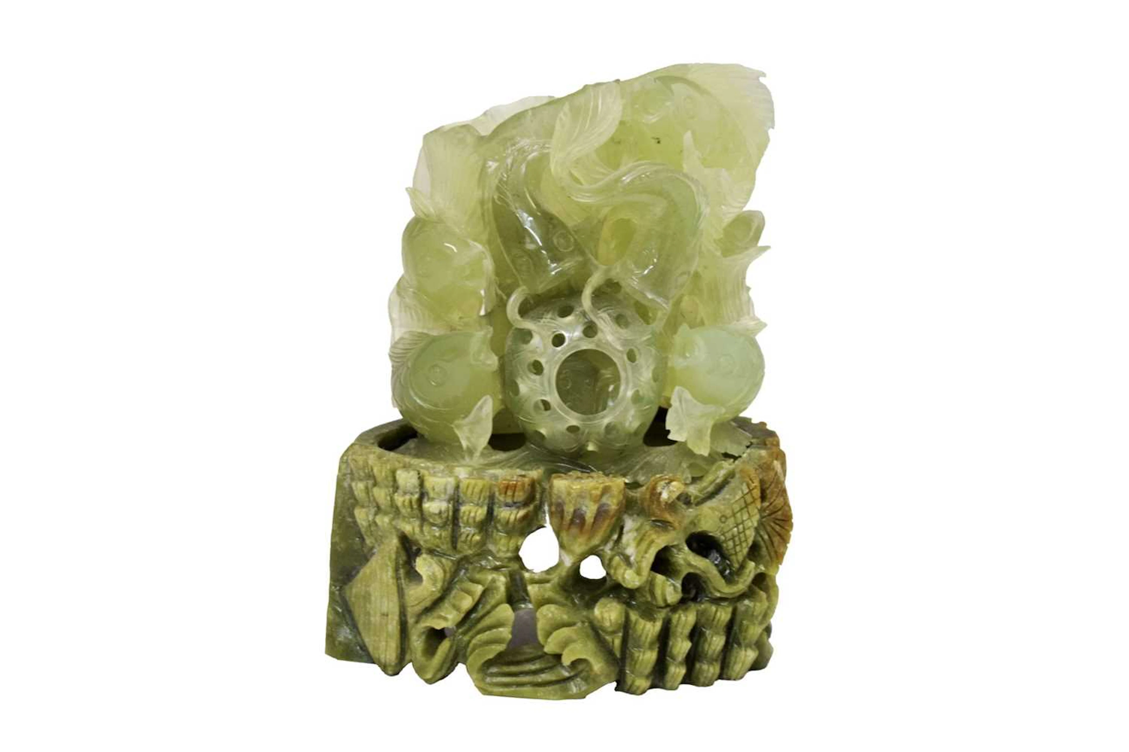 Jade-coloured hardstone carved figure group of fish