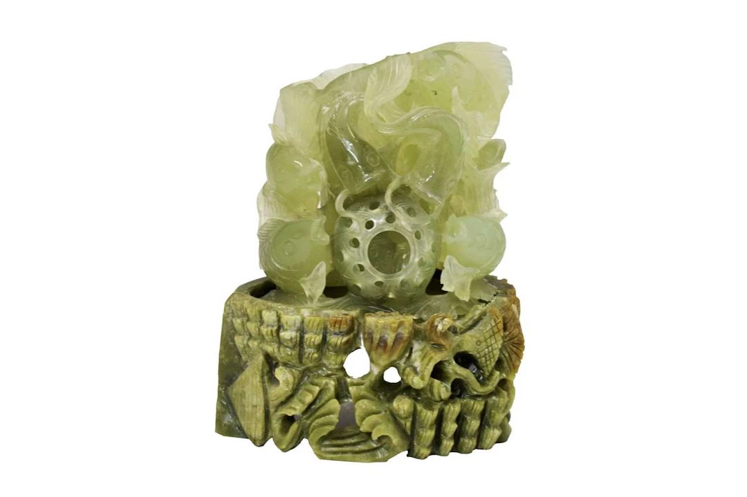 Jade-coloured hardstone carved figure group of fish