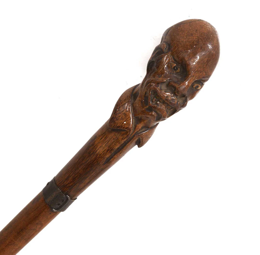 Late Victorian carved walking stick or cane - figural handle