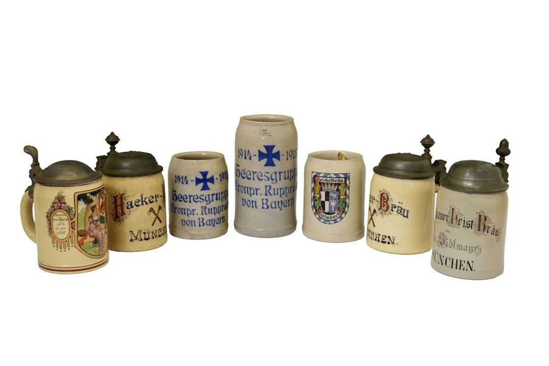 Group of early 20th century German stoneware steins and mugs