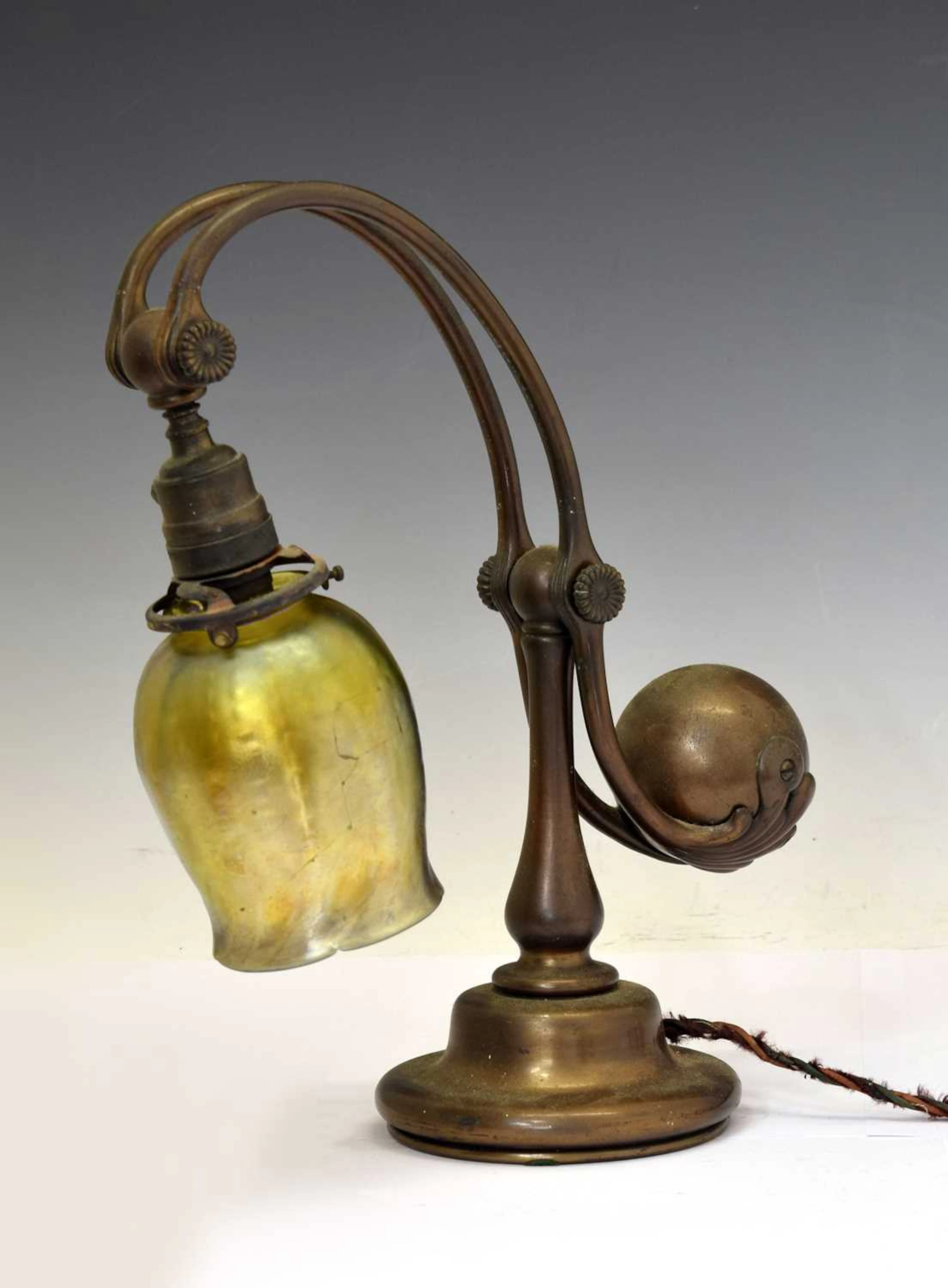 Tiffany Studios, a counter-balance patinated bronze desk lamp with