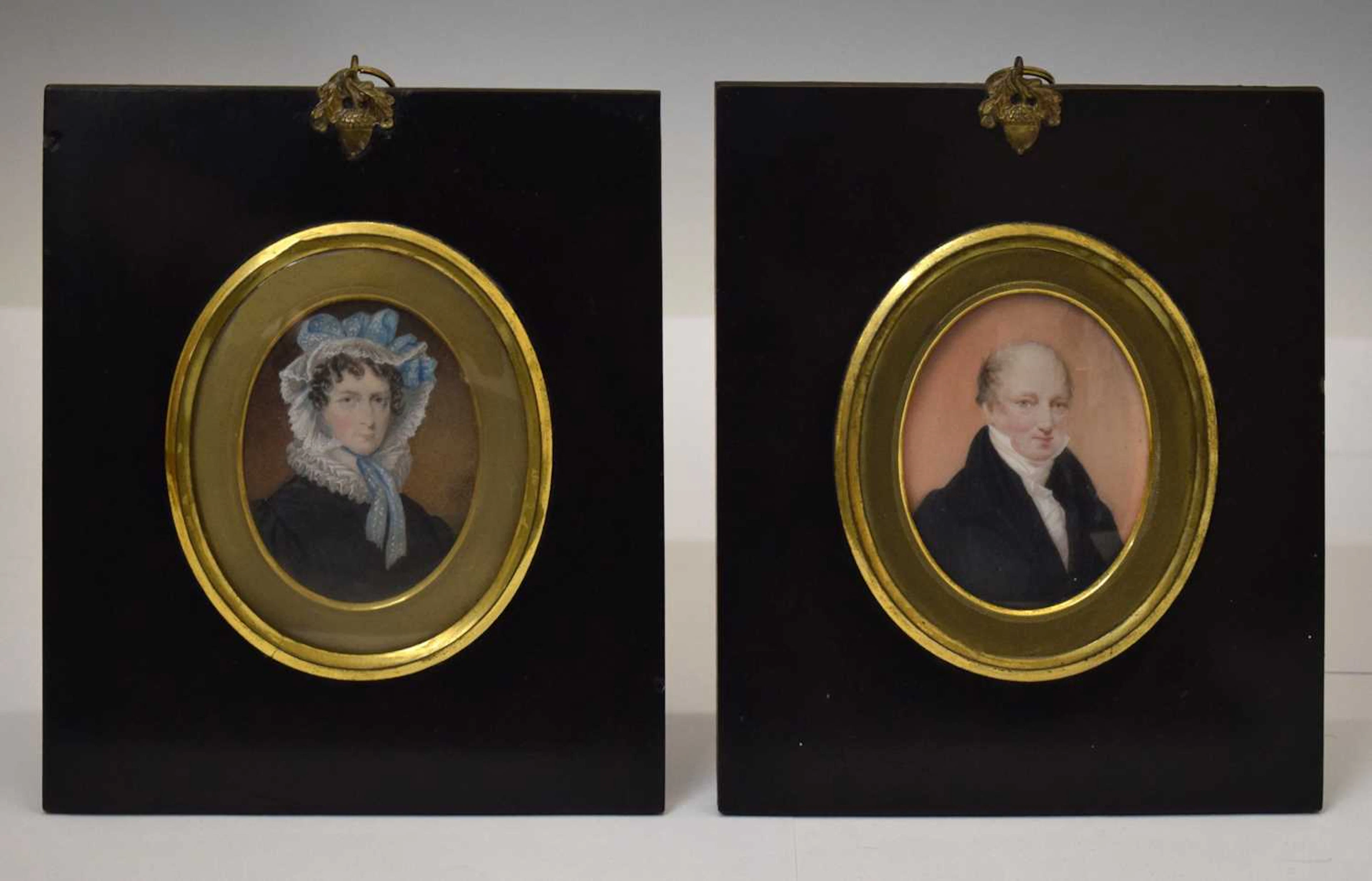 Pair of mid 19th century portrait miniatures on ivory