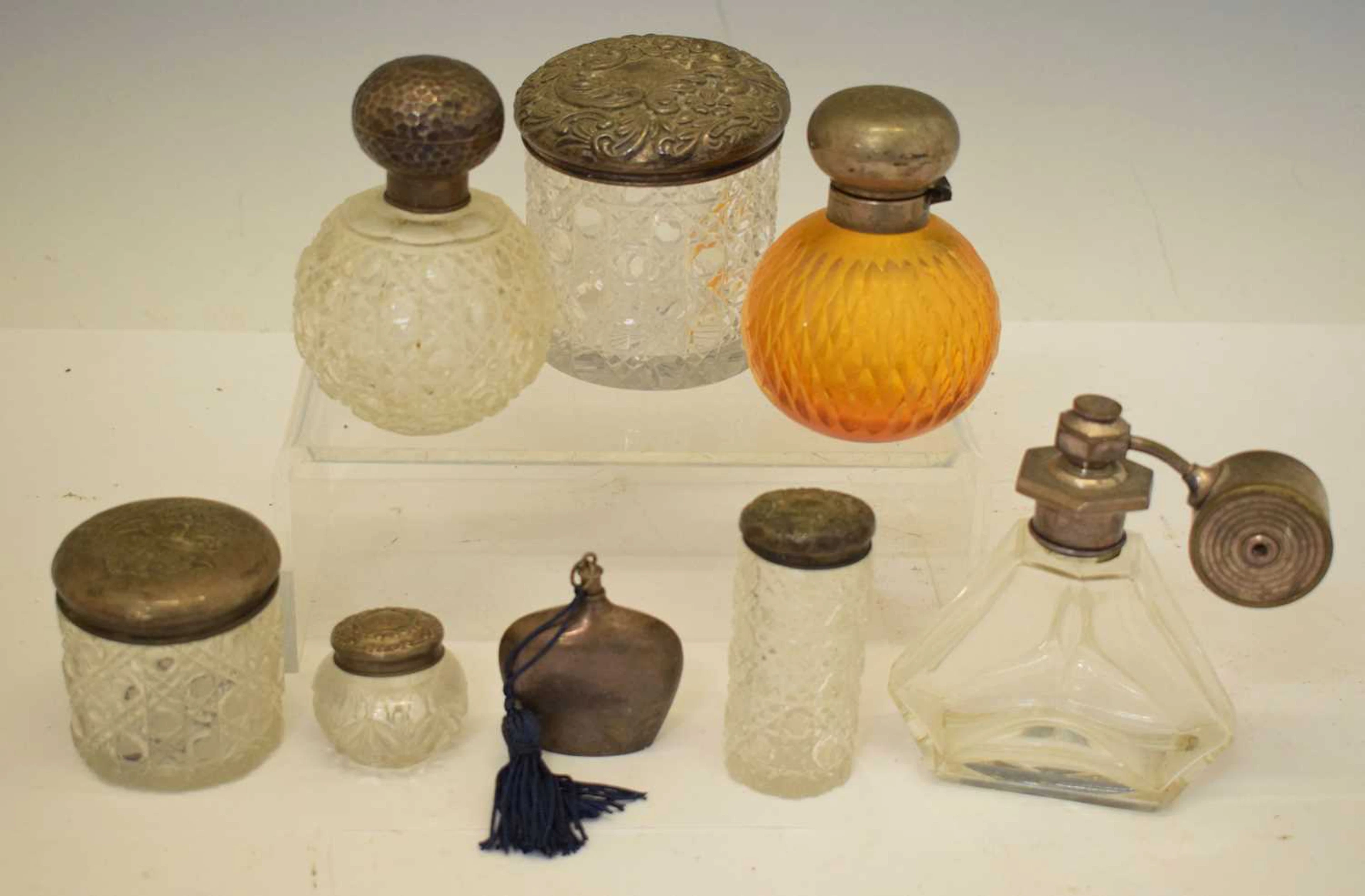 Group of silver-mounted perfume bottles, silver-topped cut glass dressing