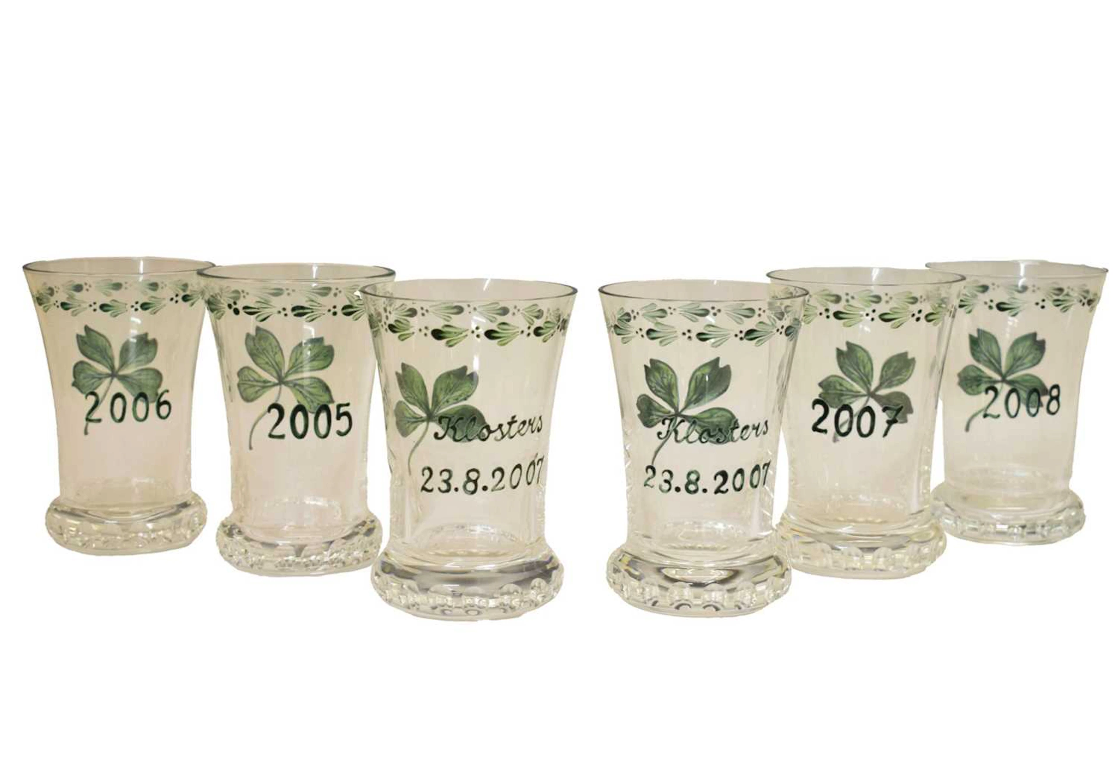 Maison Dior - Four painted glass 'New Year' vases, etc