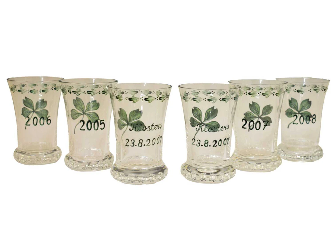 Maison Dior - Four painted glass 'New Year' vases, etc