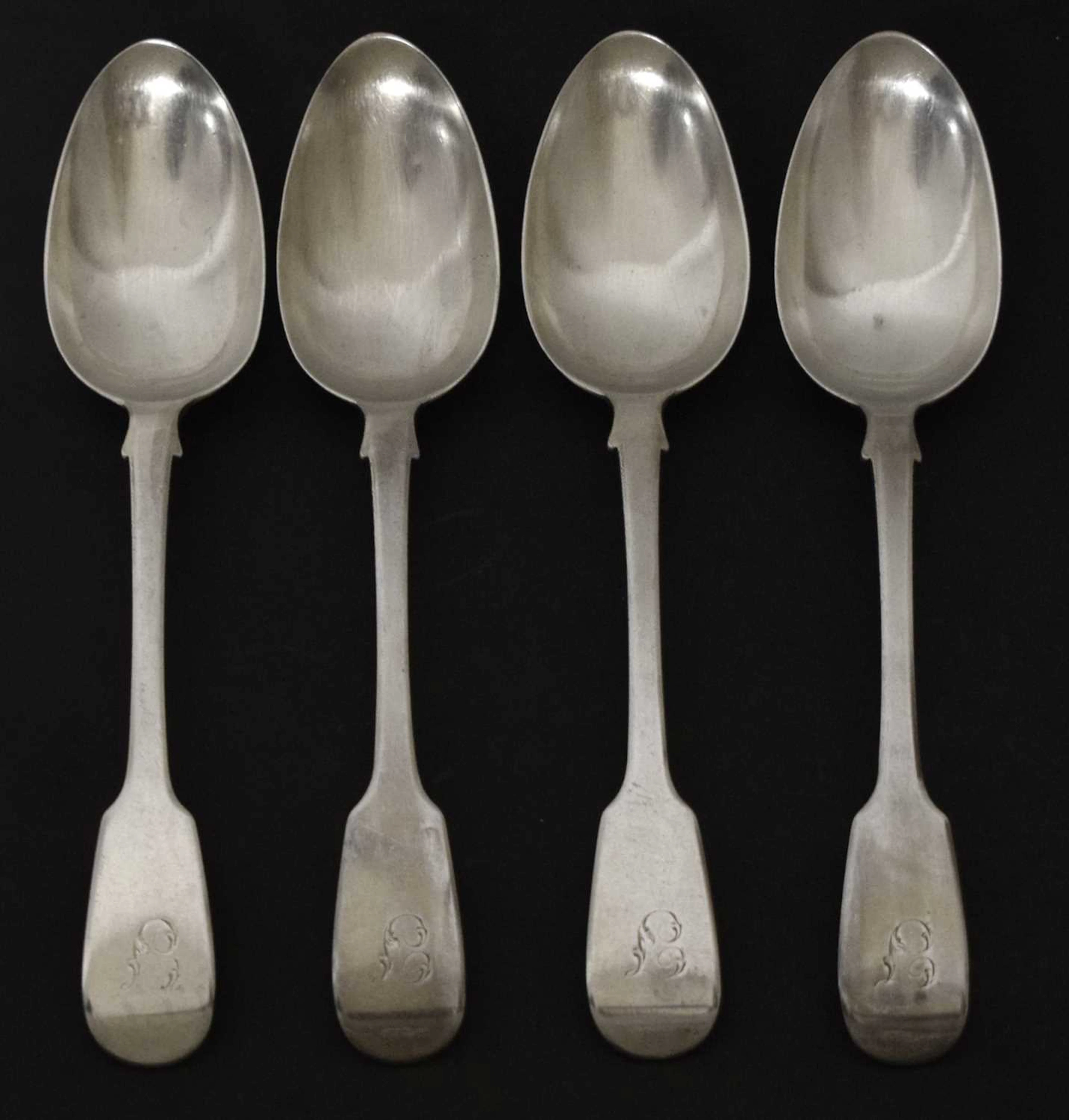 Four George IV silver fiddle pattern table spoons