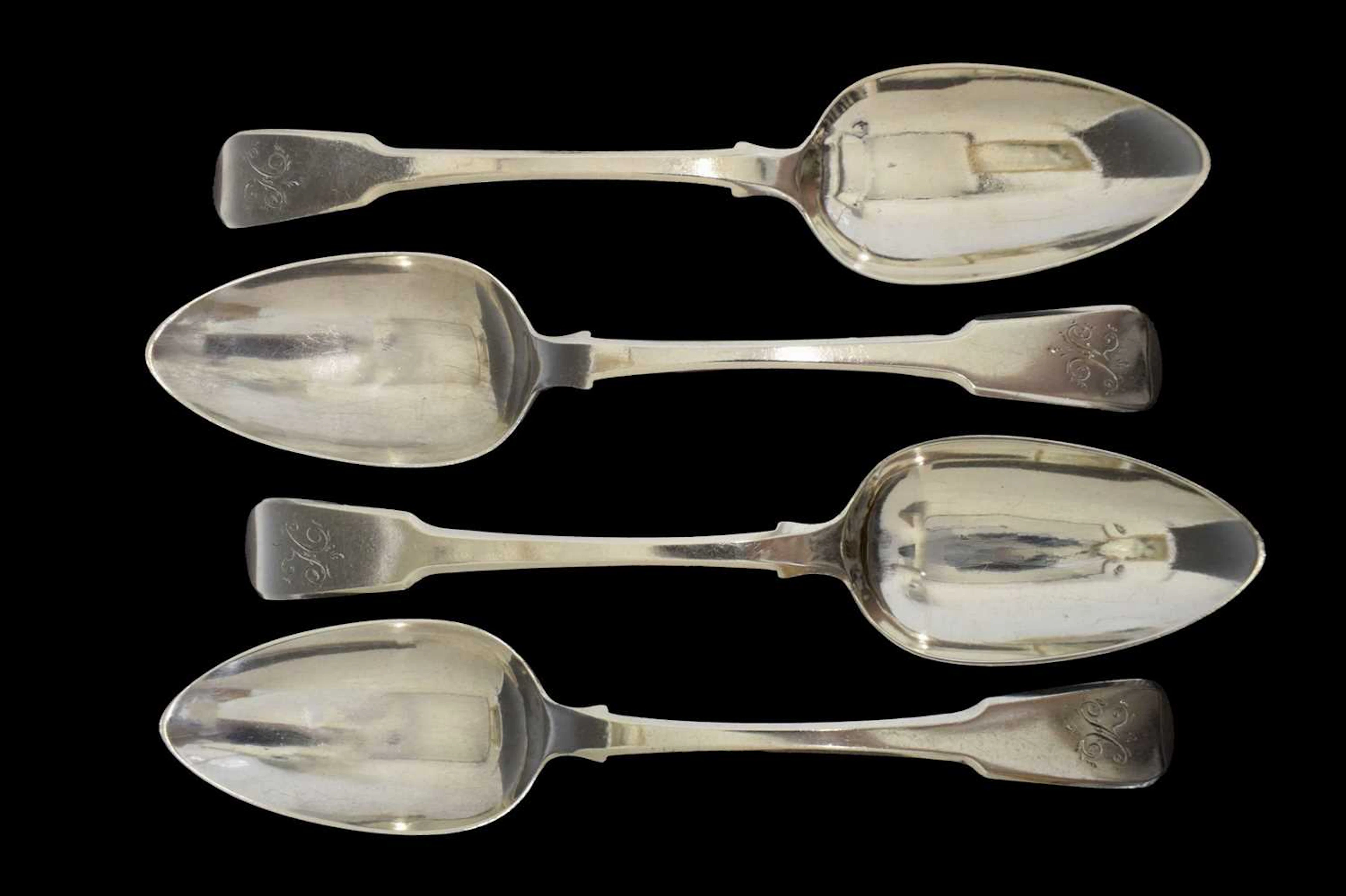 Set of four George III silver Fiddle pattern table spoons