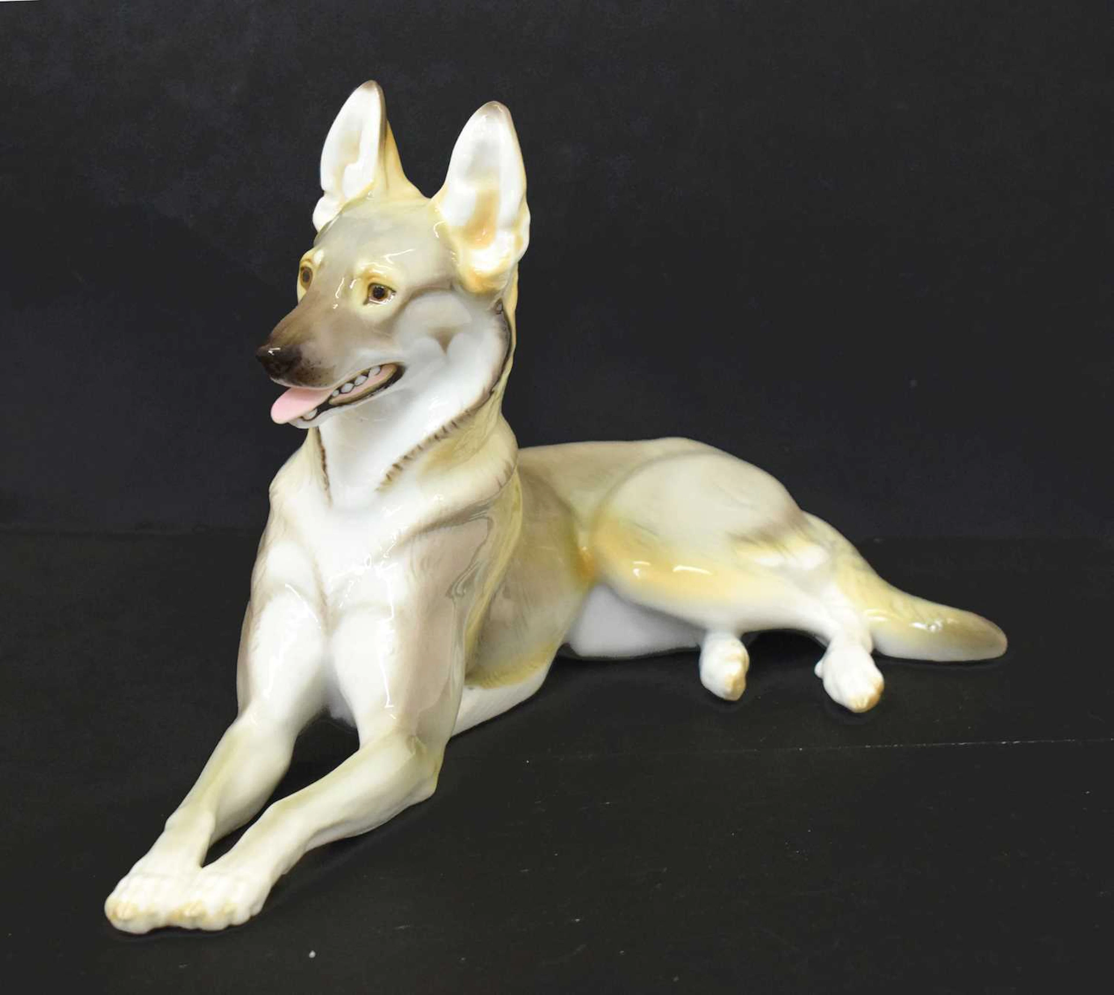 20th century Nymphenburg porcelain figure of a recumbent German shepherd dog