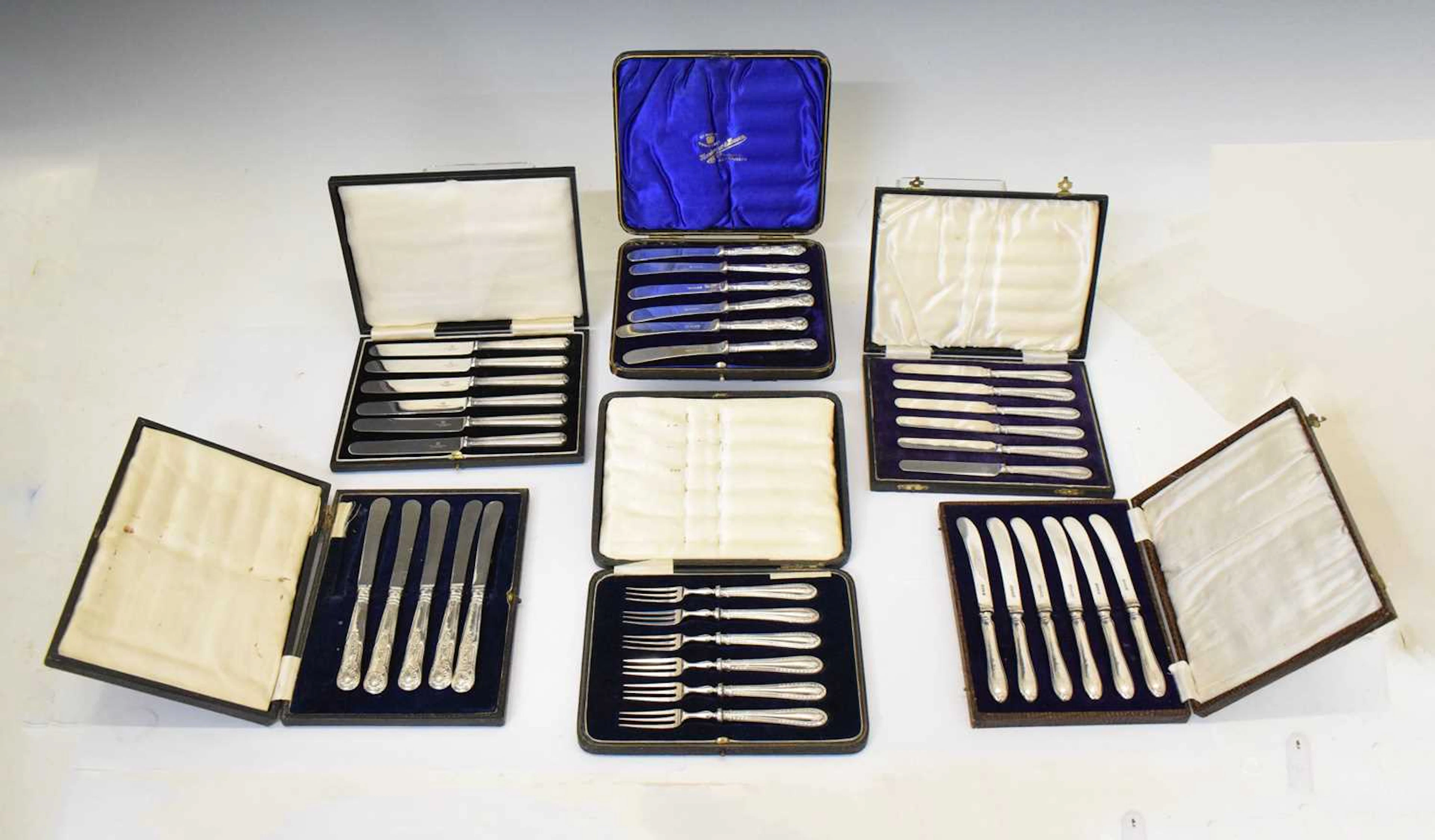 Set of silver-handled pastry forks, and a collection of silver-handled