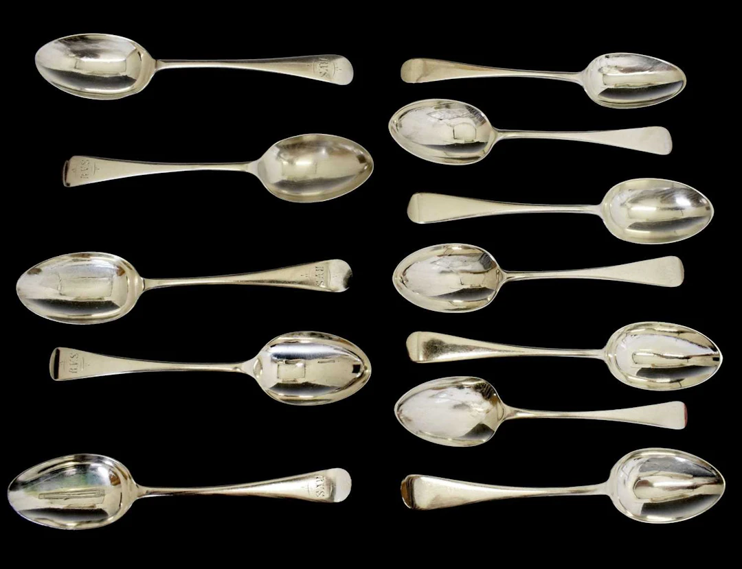 Matched set of twelve silver Old English pattern dessert spoons