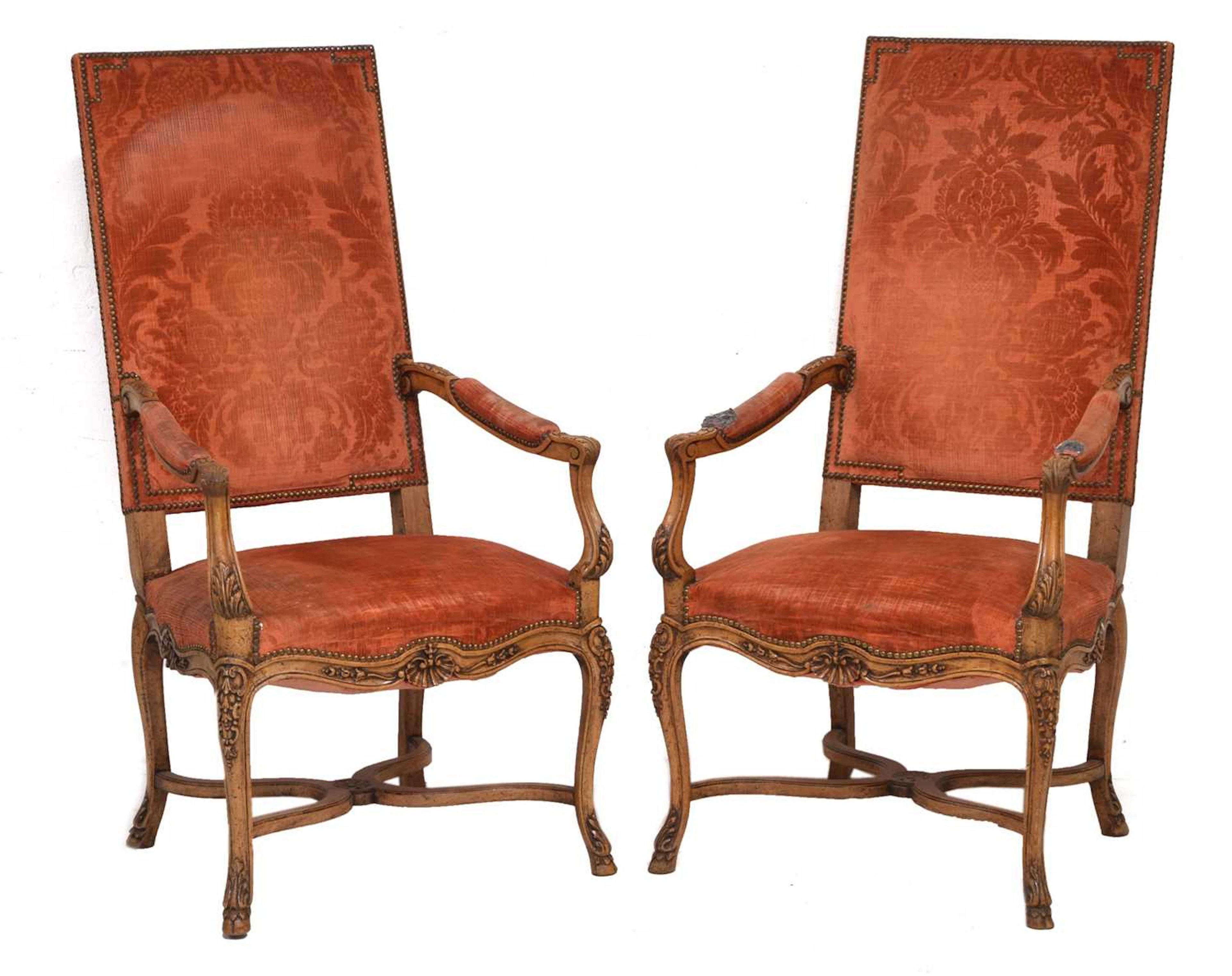 Pair of Louis XIV style carved fruitwood open armchairs or fauteuils