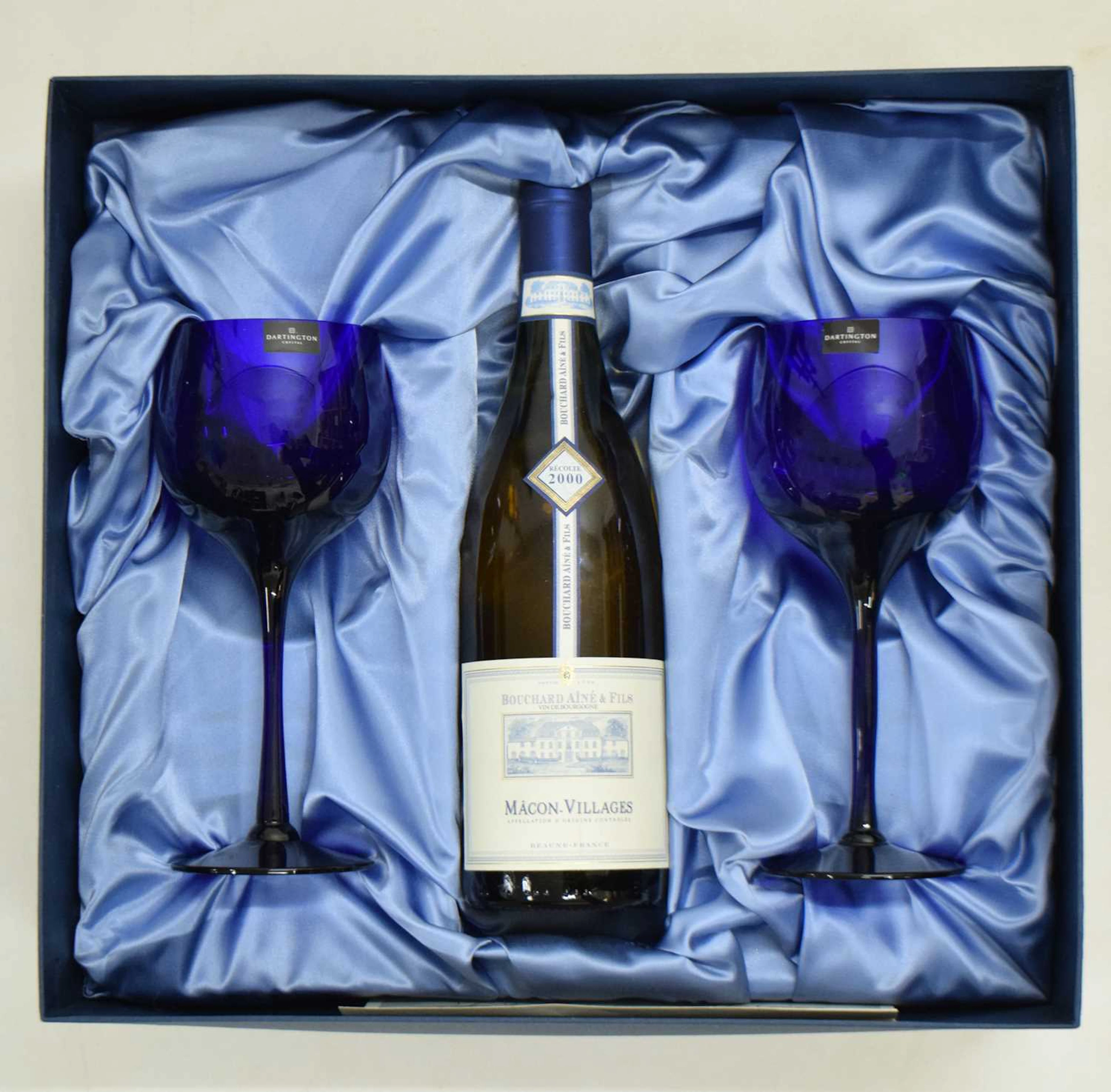 Two 'Bristol Blue' glass wine goblets by Dartington, and a bottle