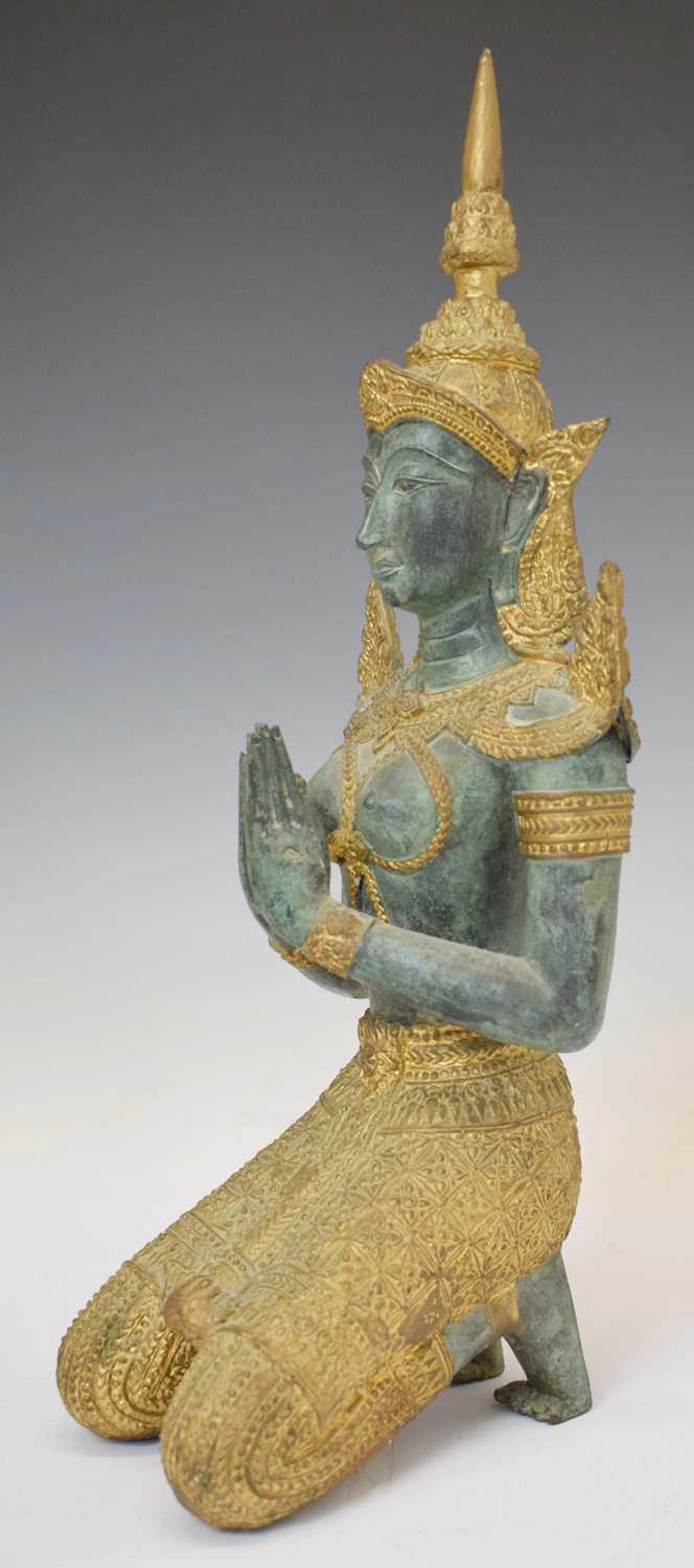20th century Thai cast brass and parcel gilt kneeling figure